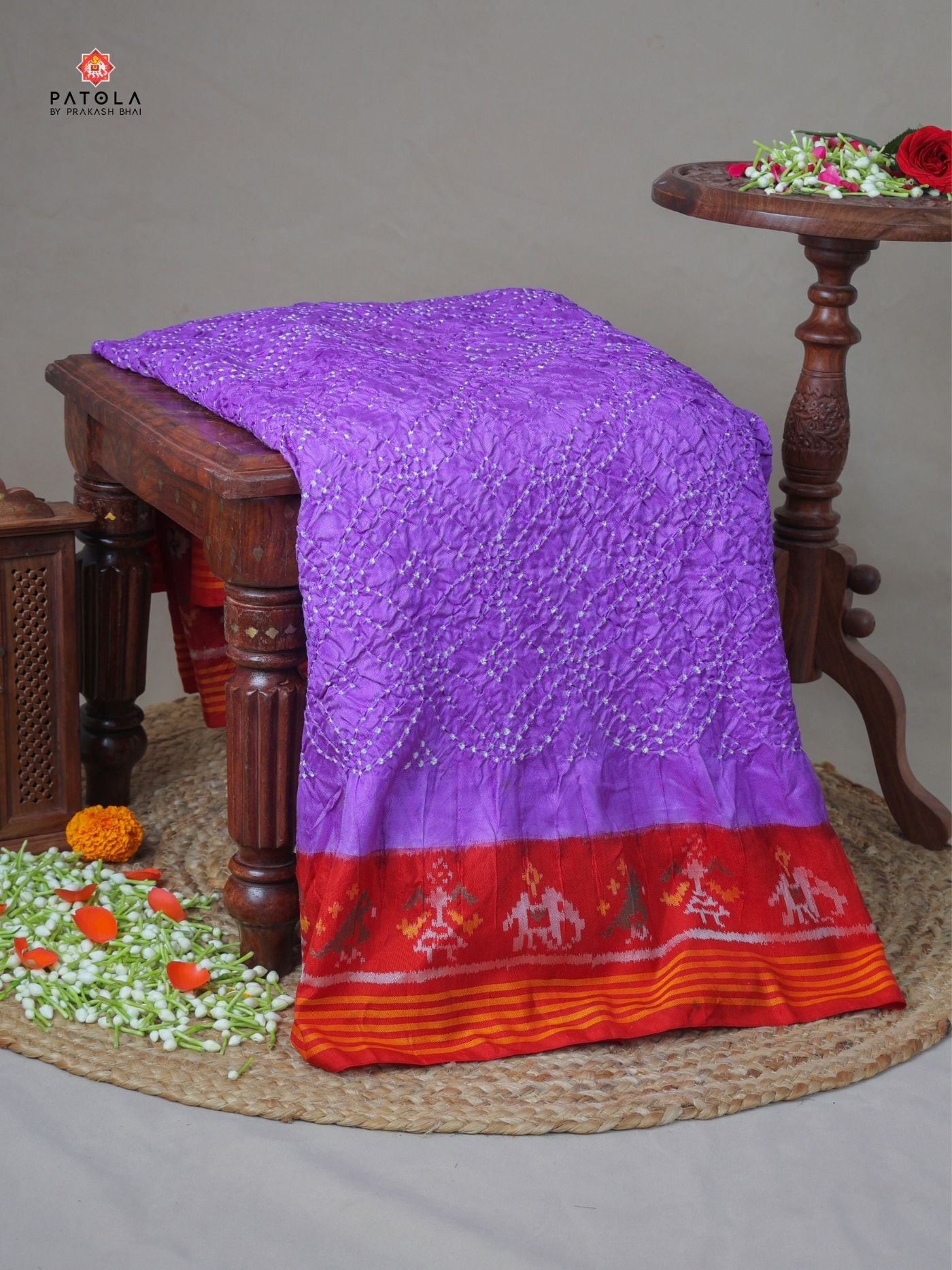 Hathi-popat border with small bandhej patola saree Blouse design