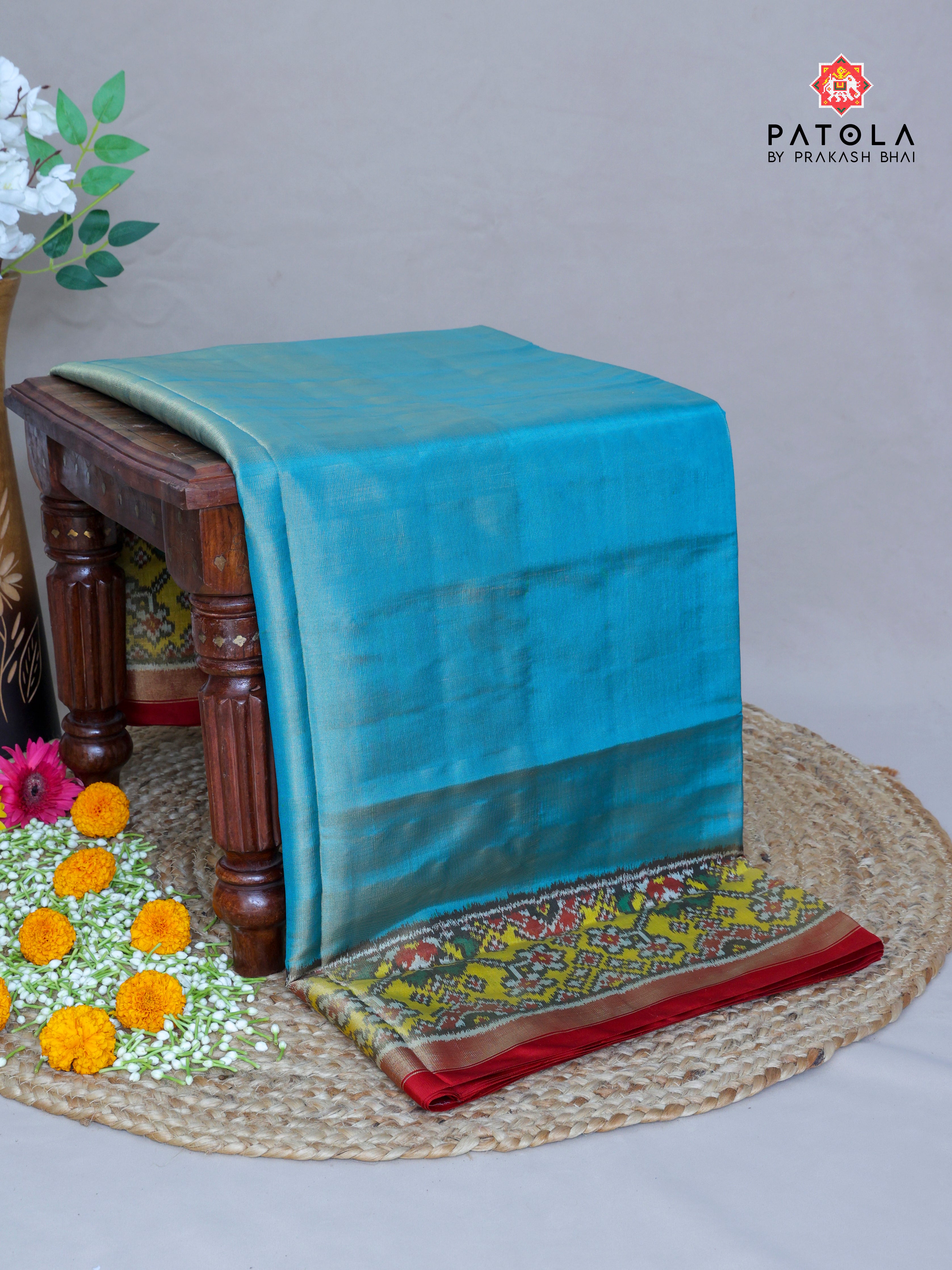Plain Sky Blue With Yellow Navratna Border Tissue Patola Saree