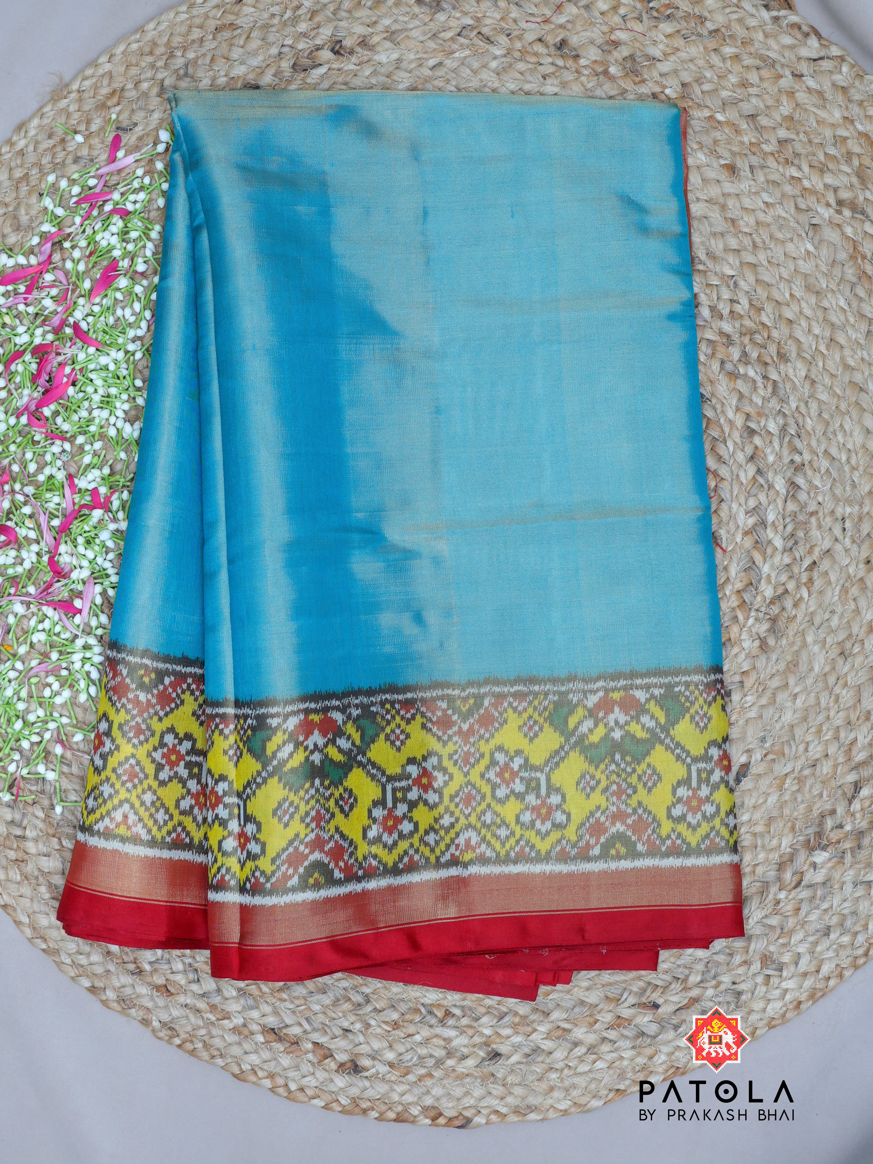 Plain Sky Blue With Yellow Navratna Border Tissue Patola Saree