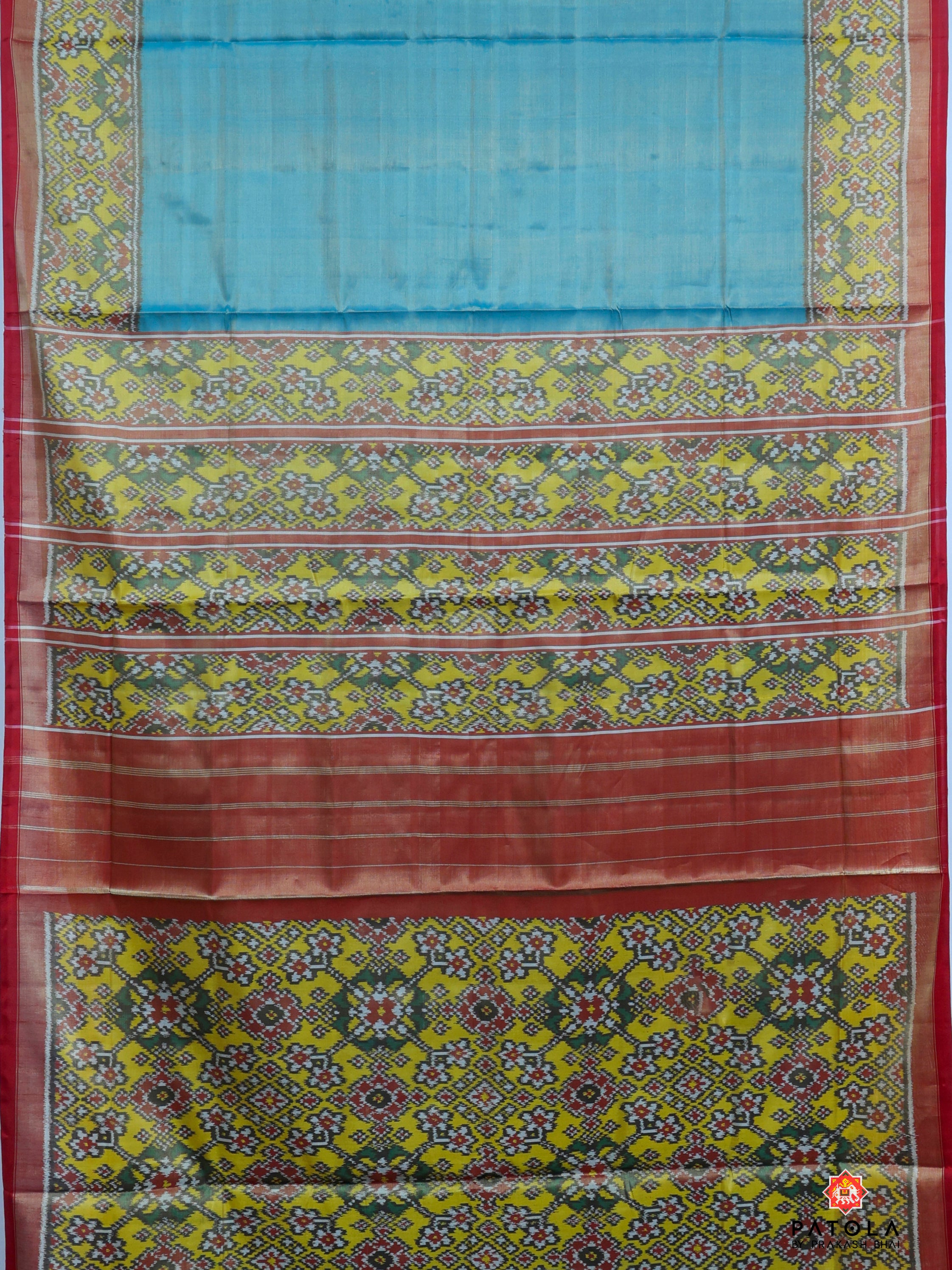 Plain Sky Blue With Yellow Navratna Border Tissue Patola Saree