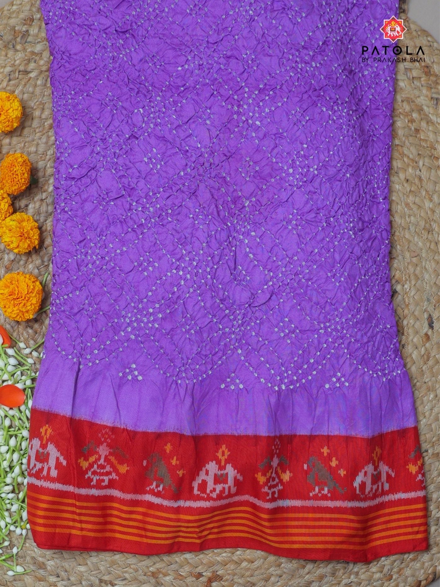 Hathi-popat border with small bandhej patola saree Blouse design