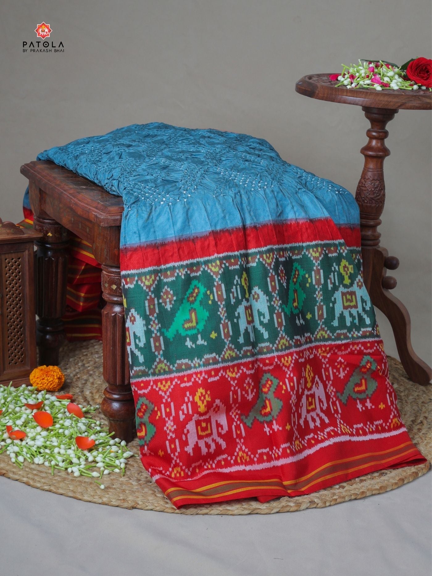 Two colors border with small bandhej patola saree Blouse design