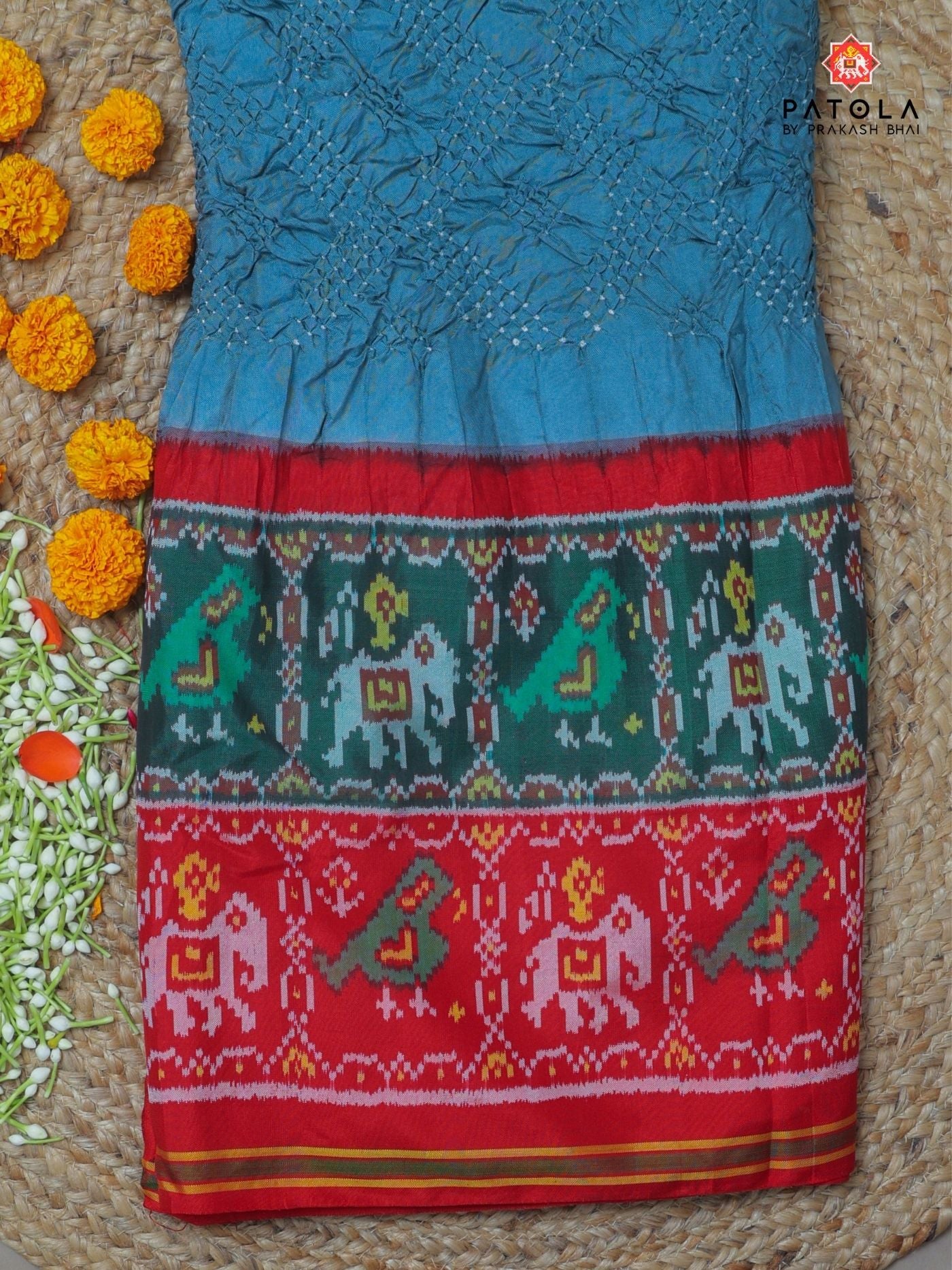 Two colors border with small bandhej patola saree Blouse design