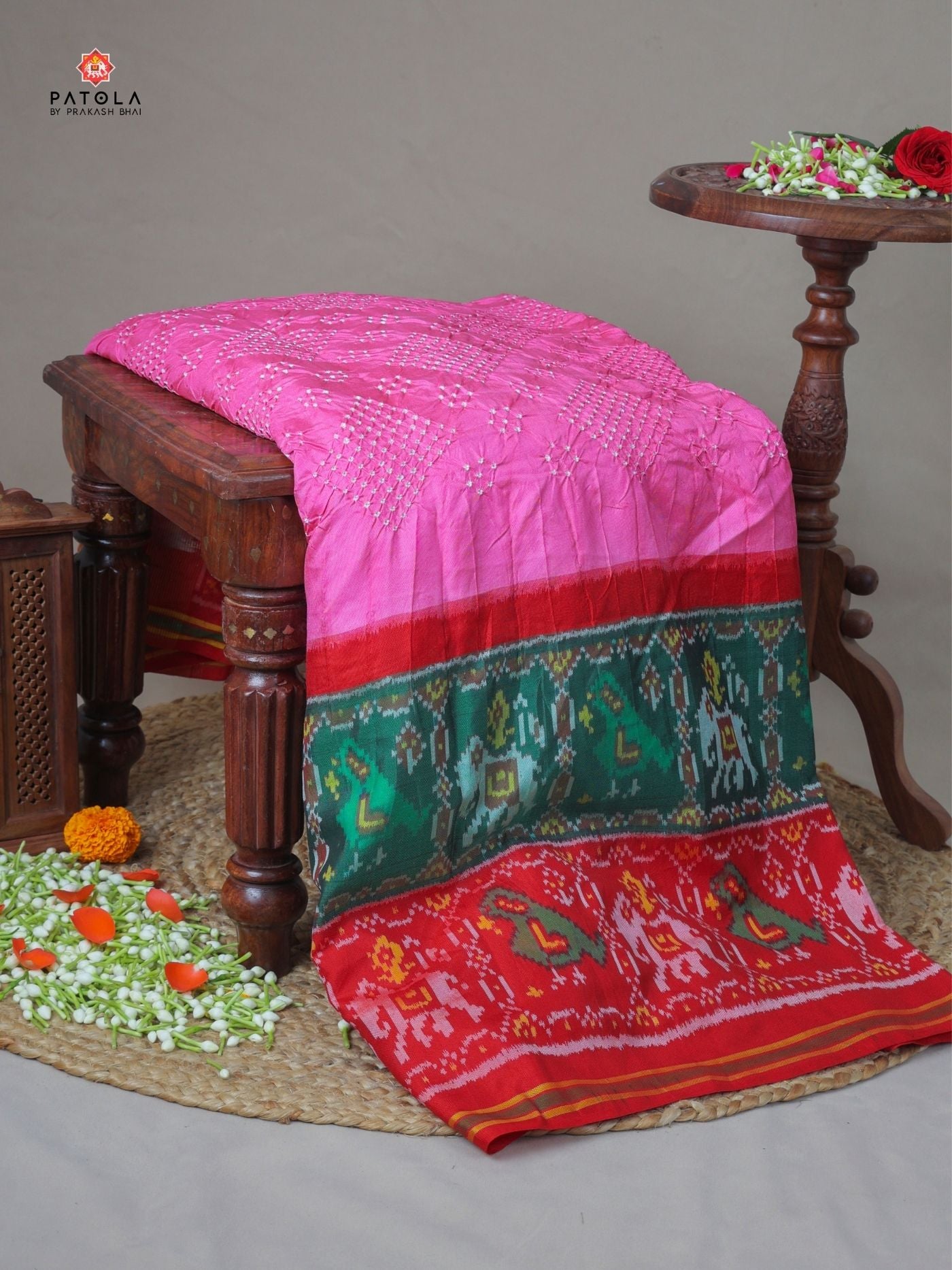 Two colors border with small bandhej patola saree Blouse design