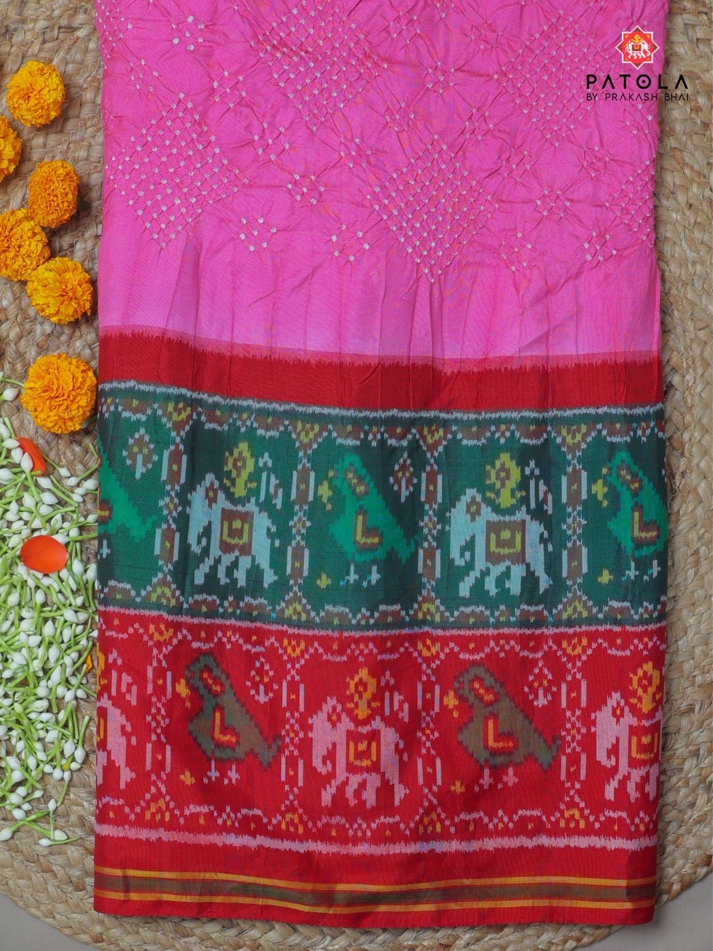 Two colors border with small bandhej patola saree Blouse design