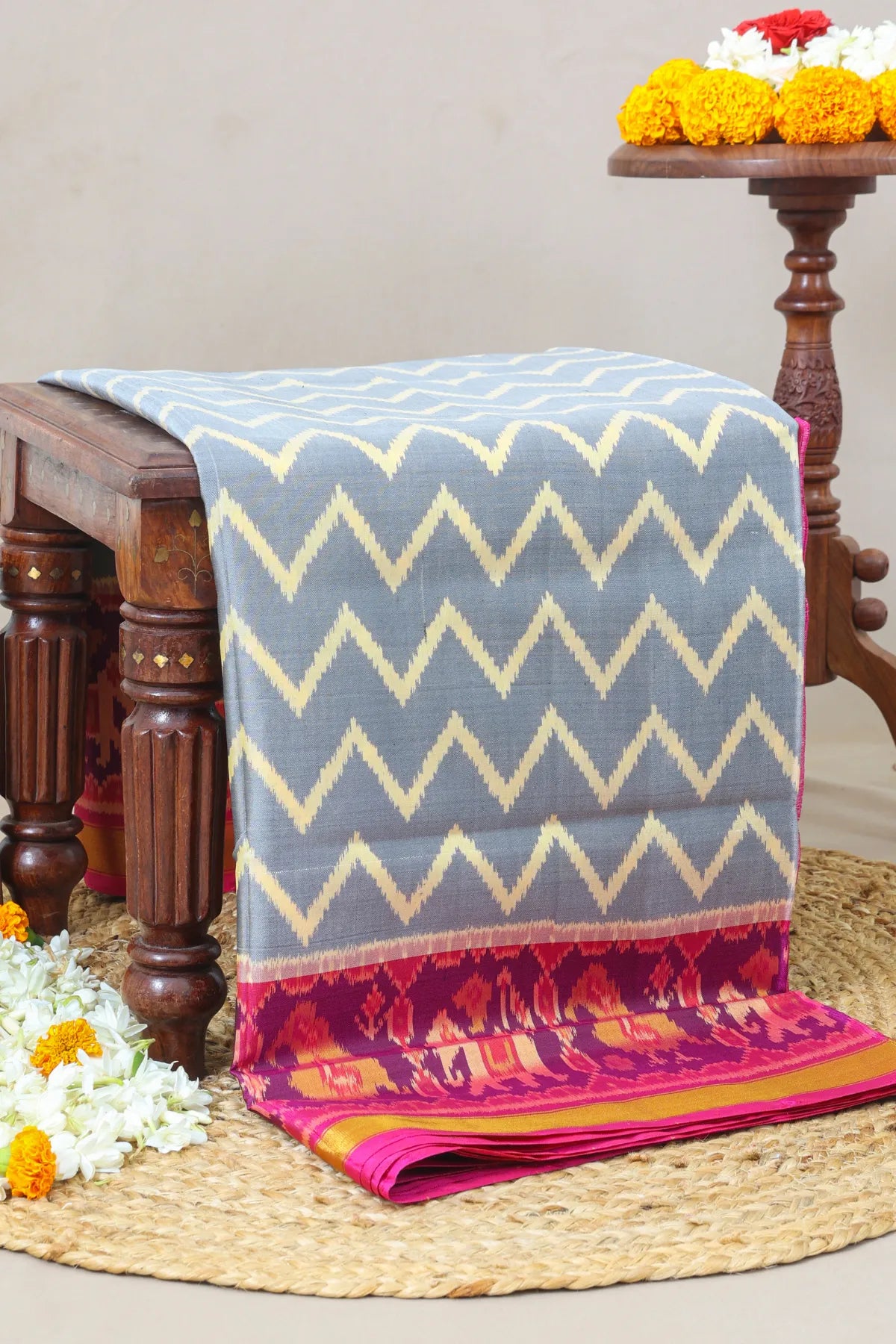 Zig-zag with traditional motifs design border single ikat patola saree