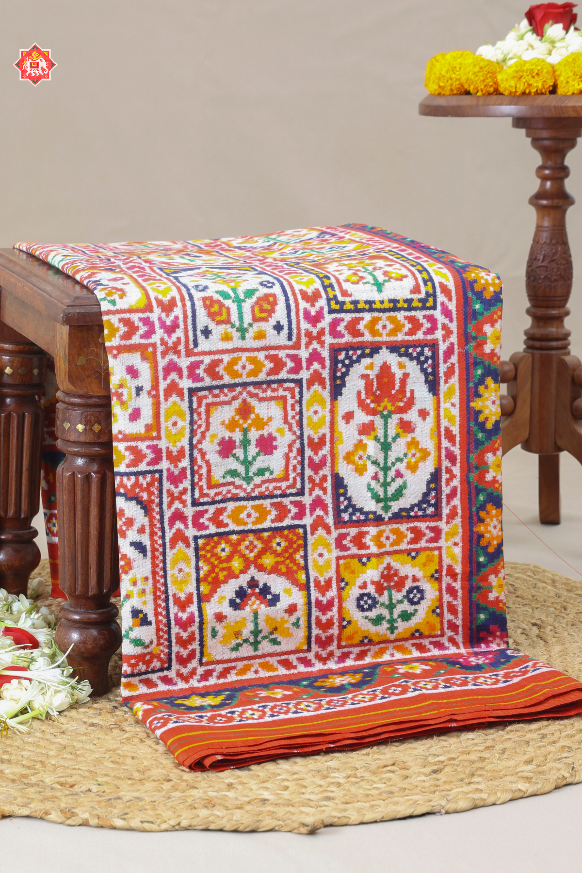 Signature piece patan patola silk double ikat jharokha design off white saree