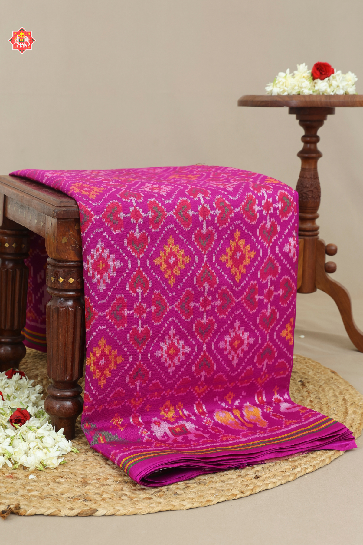 Traditional paan chnada design with motif border semi double ikat patola saree