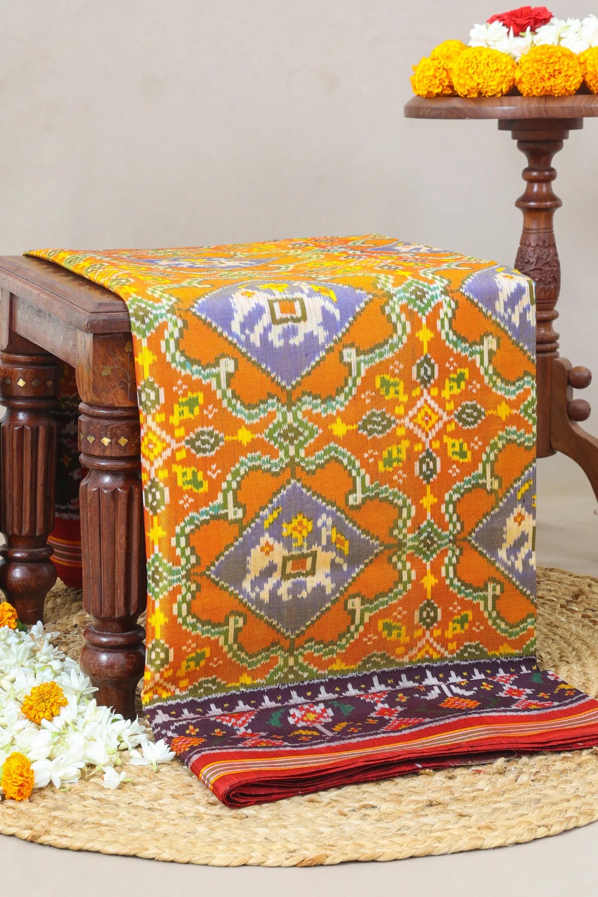 Rangoli design with elephant & pallu border ghughroo design semi double ikat patola saree