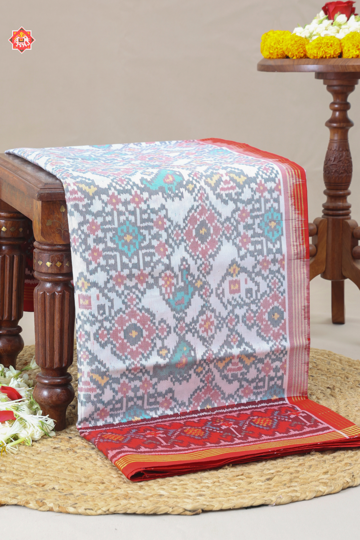 Traditional navratn design with small motif design semi double ikat patola saree