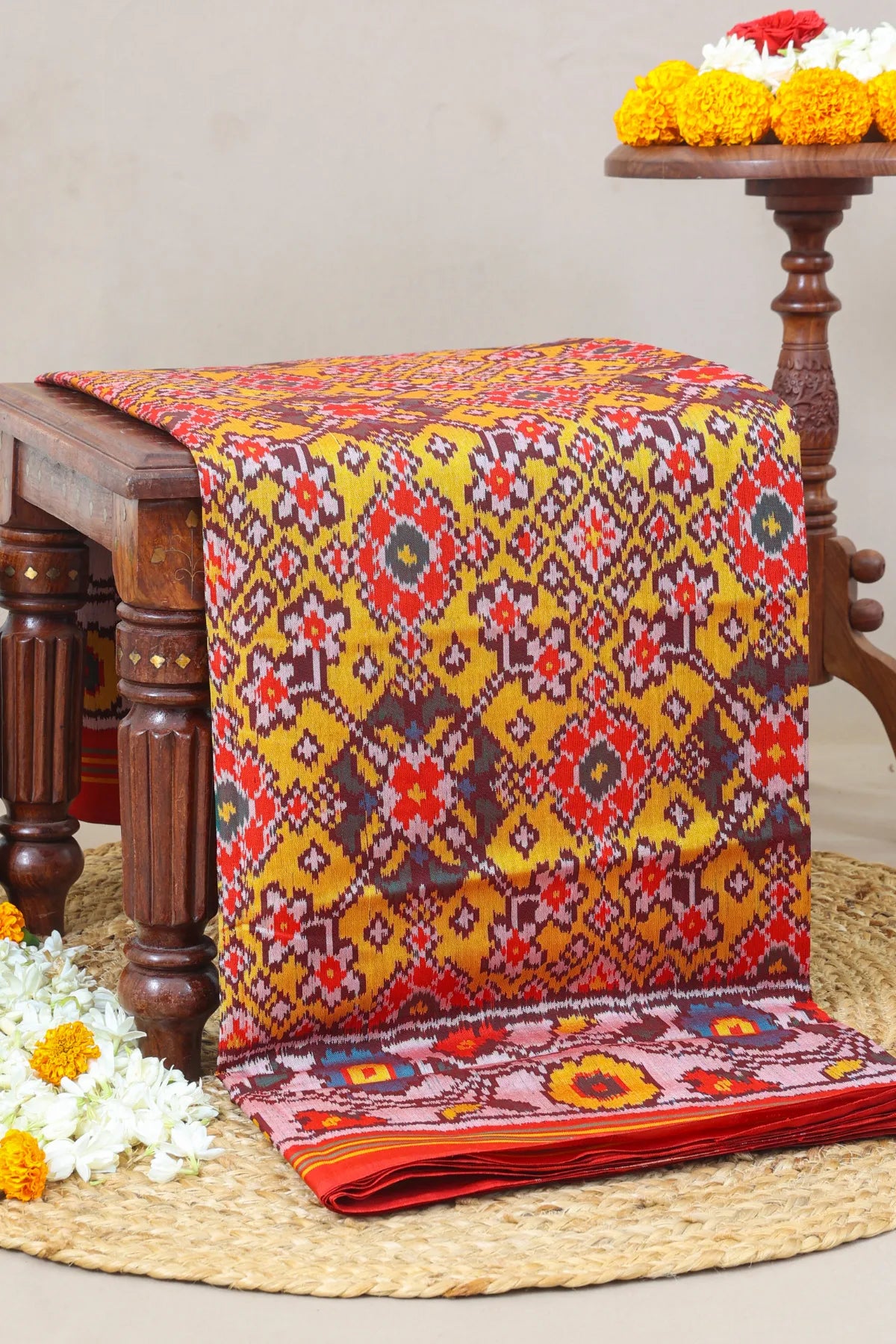 Navratna design with flowers border semi double ikat patola saree