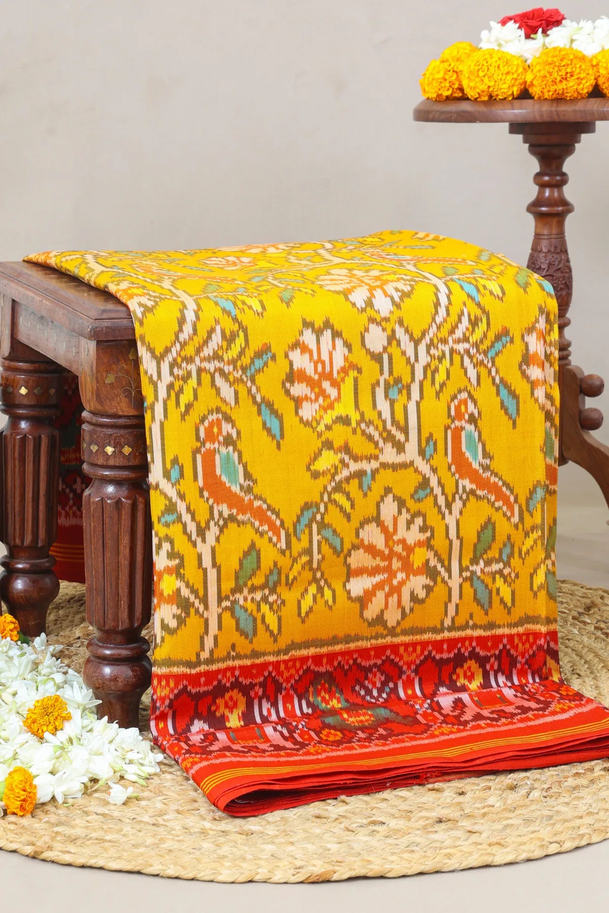 Fancy flower design with motifs design pallu border traditional design semi double ikat patola saree