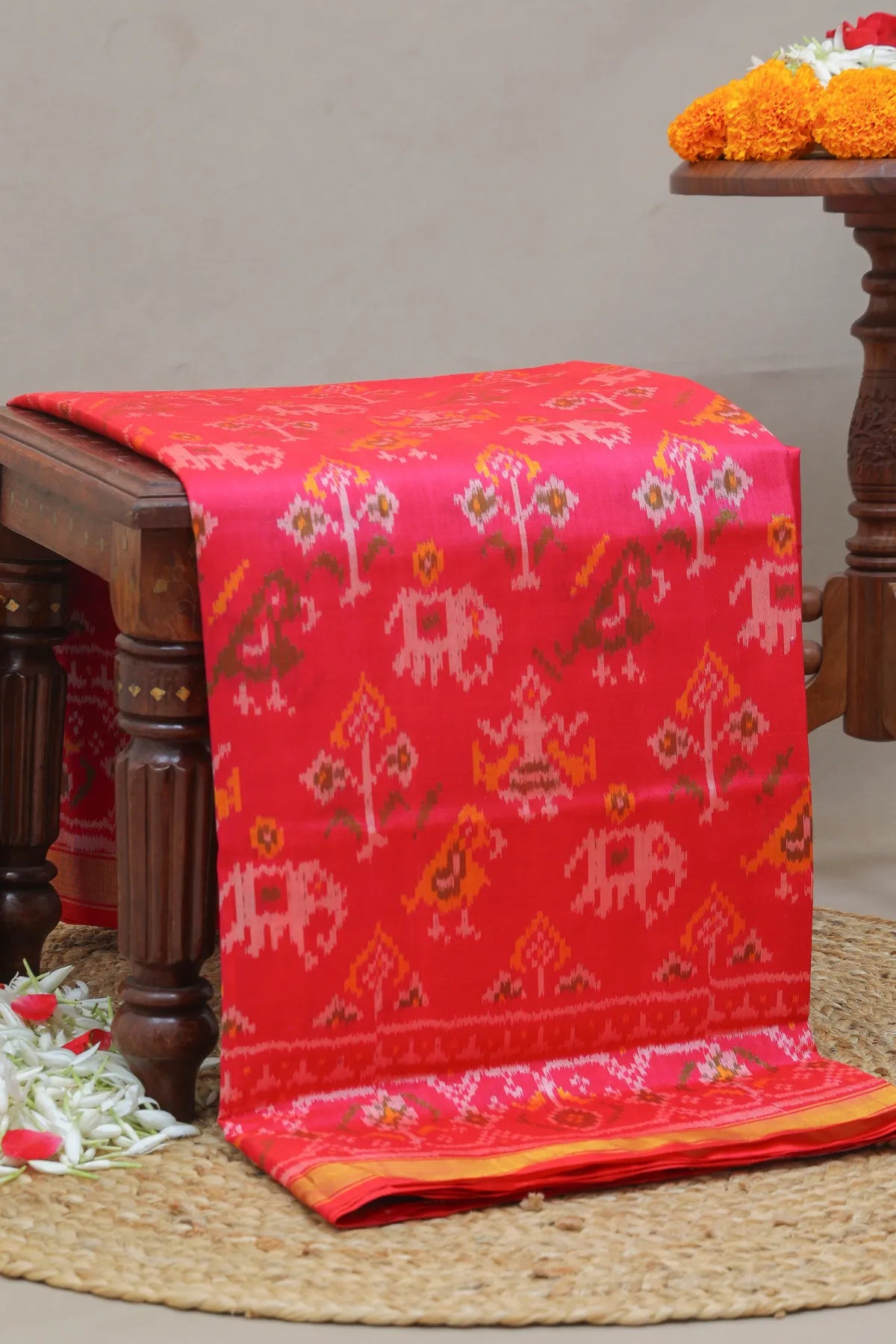 Traditional motif design with small tissue border single ikat patola saree