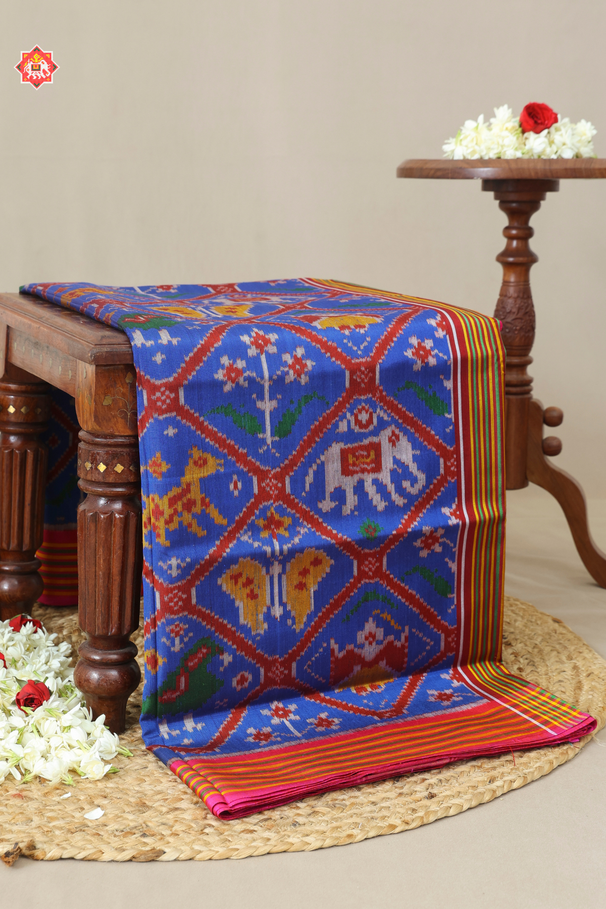 Tarditional adtala design with lines border semi double ikat patola saree