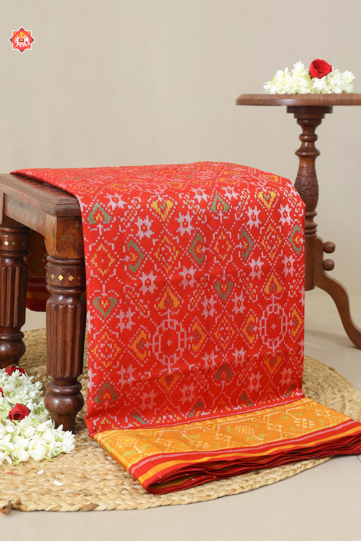 Paan chanda design with ghugroo tissue border single ikat patola saree