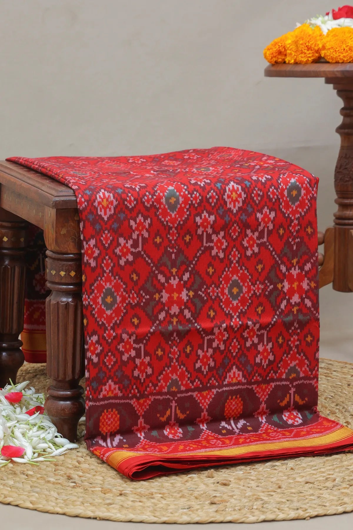Traditional navratna design small tissue border single ikat patola saree