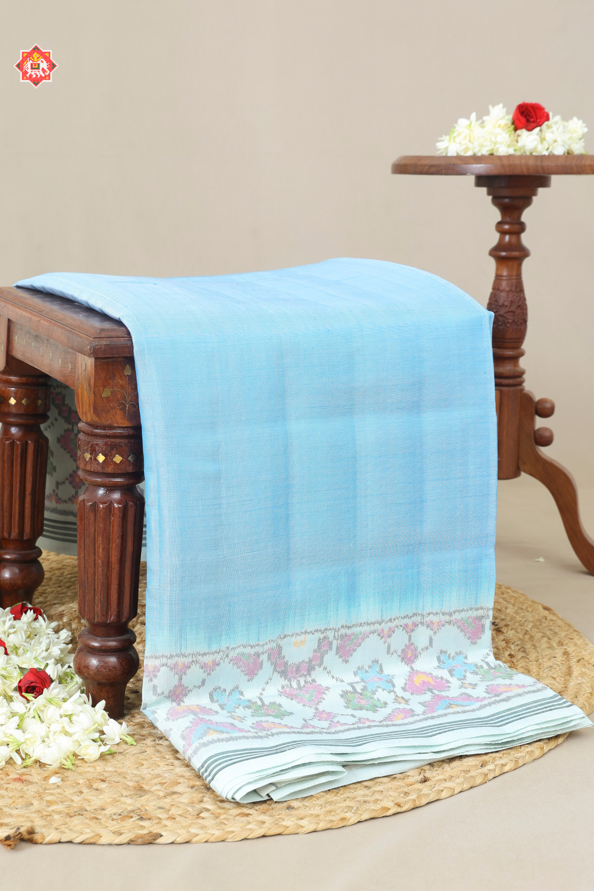 Plain sky with off-white navratna manek chowk border & blouse patola design semi double ikat patola saree