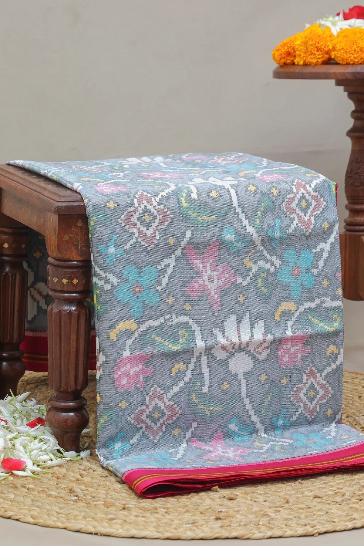Masterpiece rangoli design with lines border traditional pallu design semi double ikat patola saree