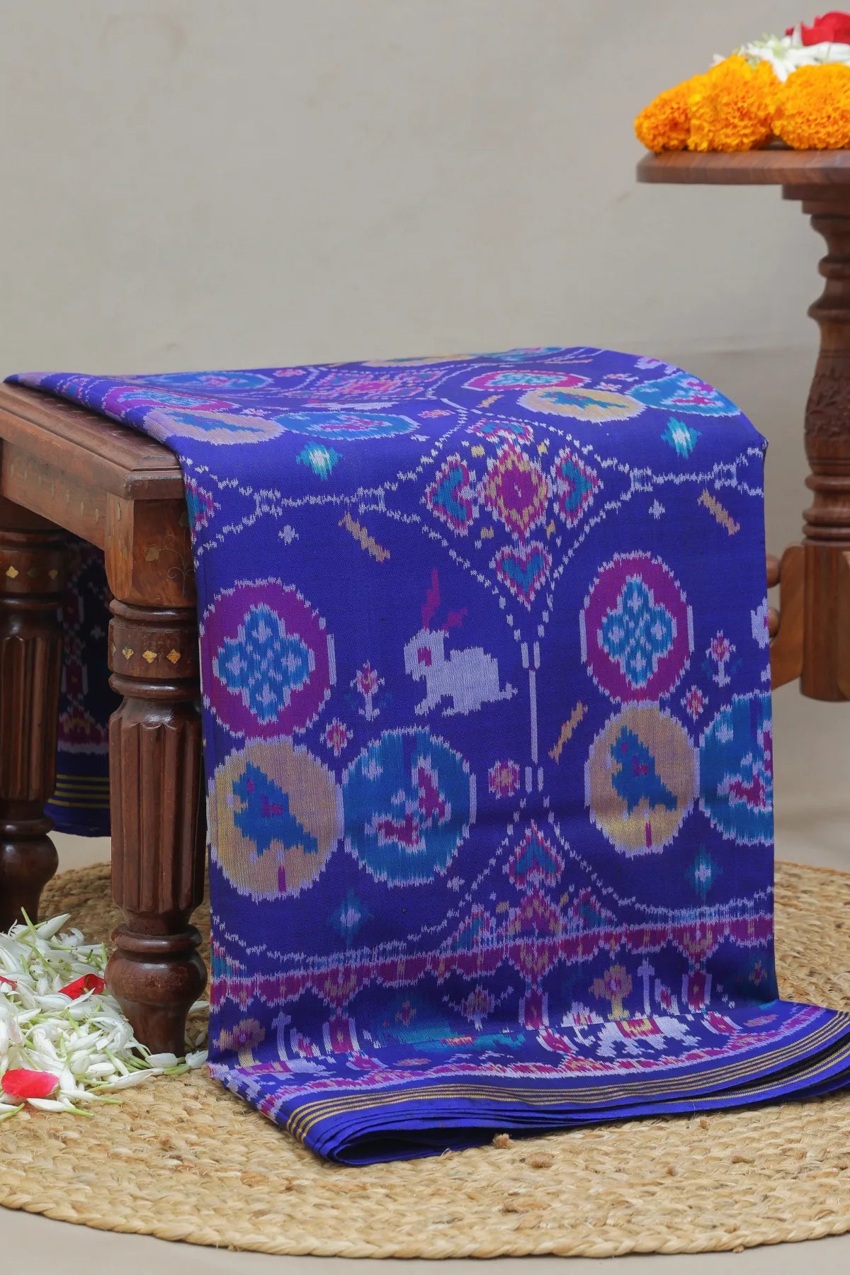 Chhabdi with motif design plain blue color semi double ikat patola saree