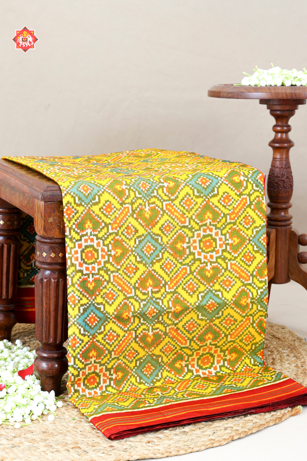 Paan chanda design with minakari work semi double ikat patola saree