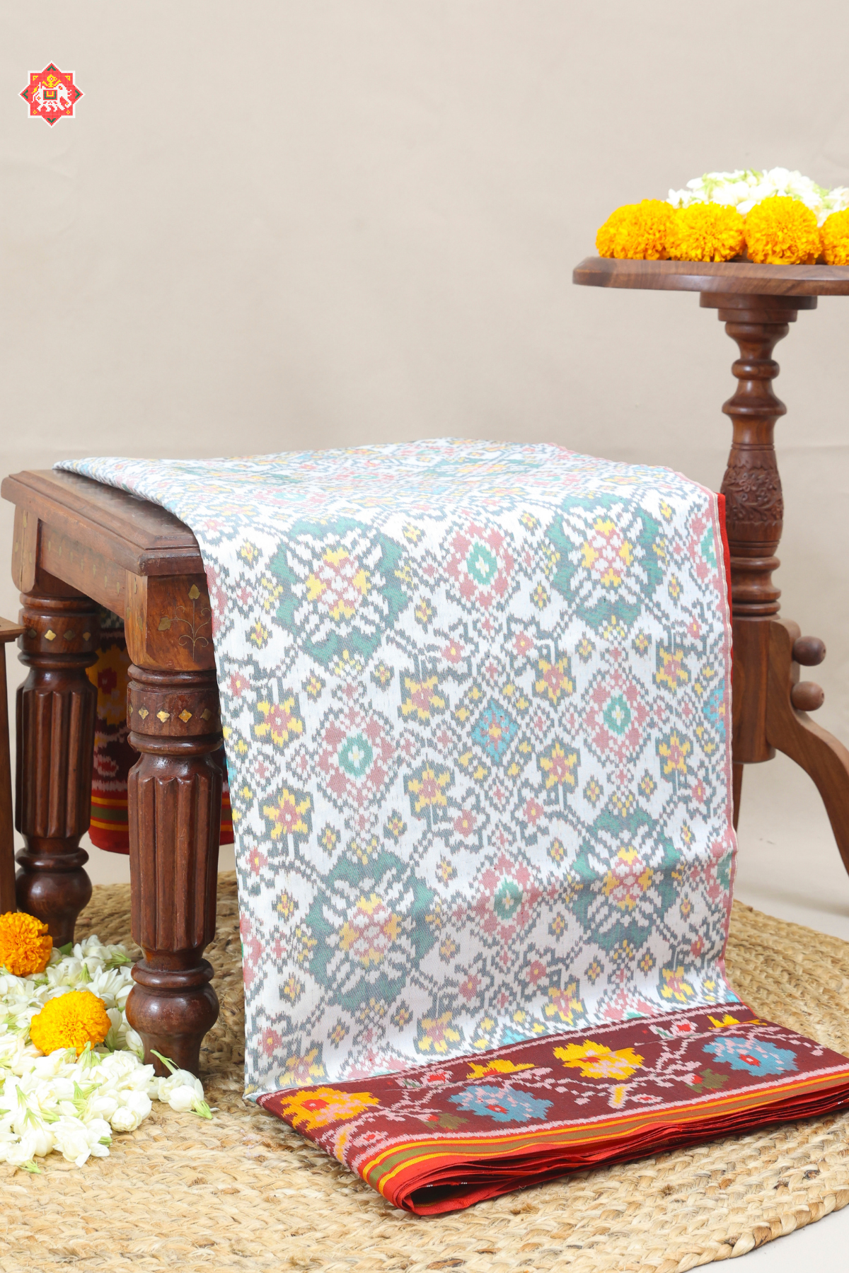 Traditional navrat design minakari work with flower border design semi double ikat patola saree