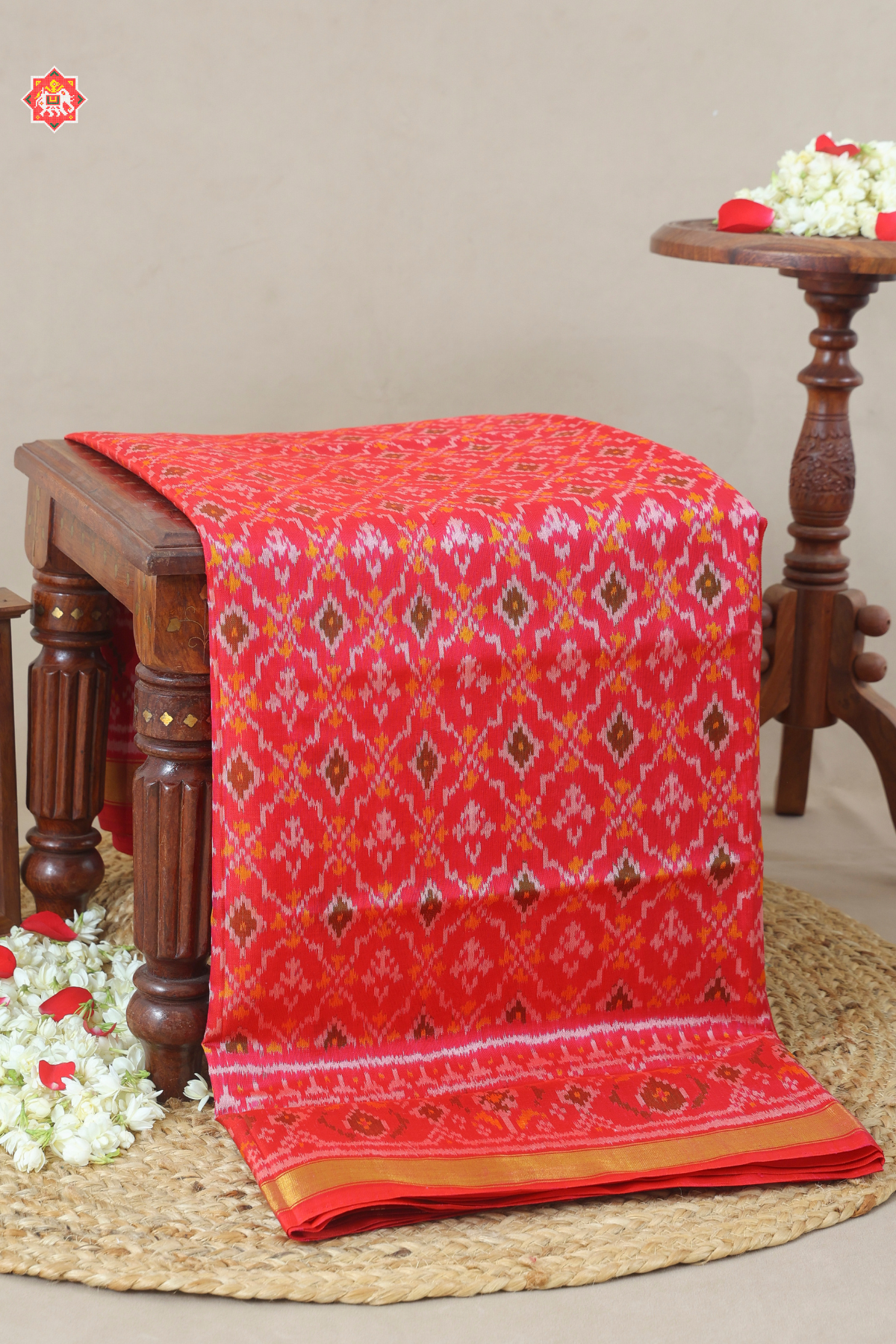 Button full design with small tissue border single ikat patola saree