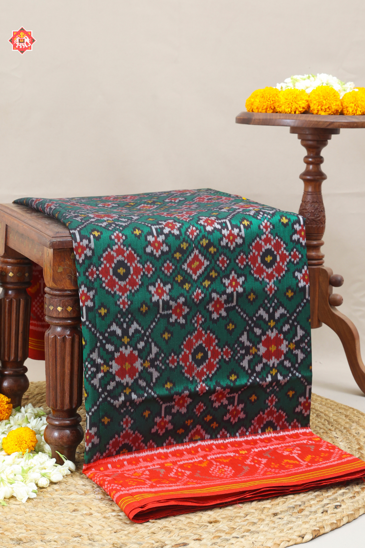 Traditional navratn design with minakari work pallu border contras semi double ikat patola saree