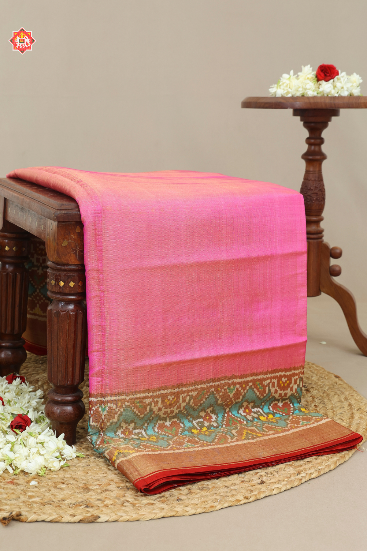 Plain pink with c-green navratna manek chowk border tissue patola saree