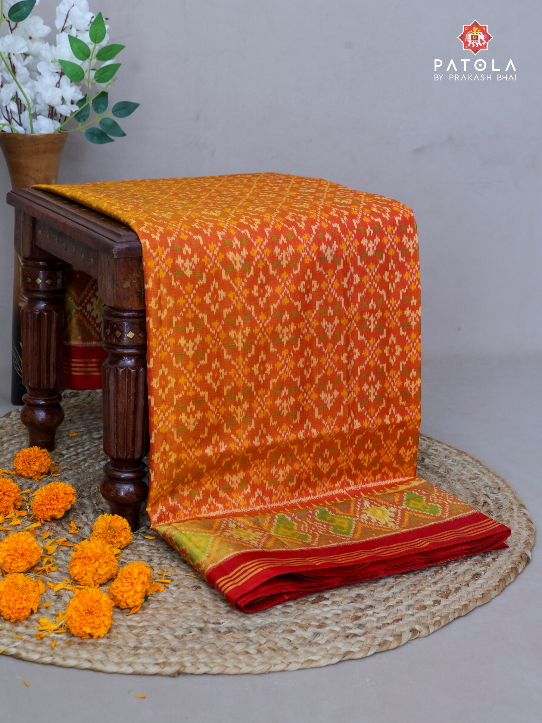 Traditional Orange Button Phool Designer Single Ikat Patola Saree