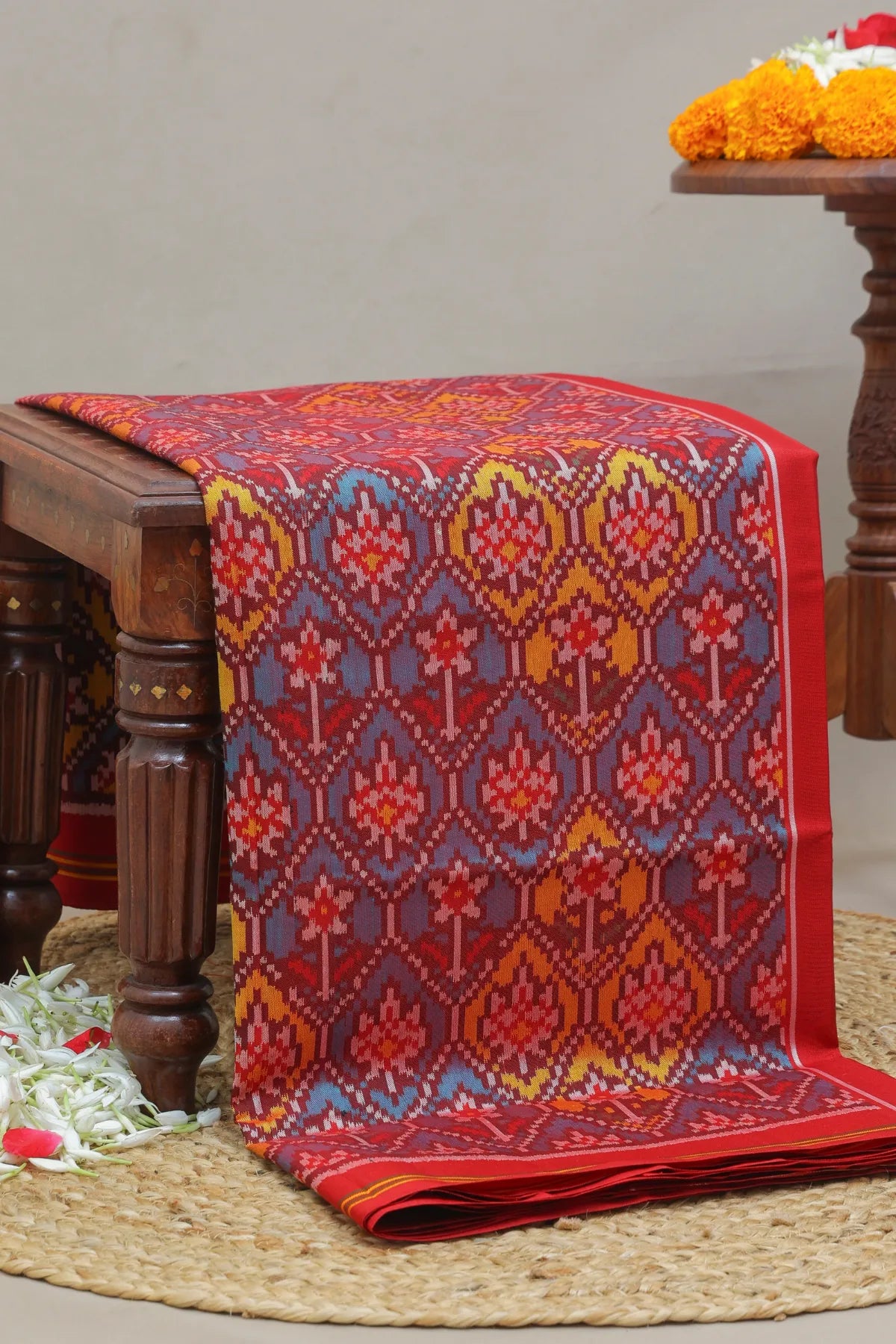 Traditional small flower design & pallu minakari work semi double ikat patola saree