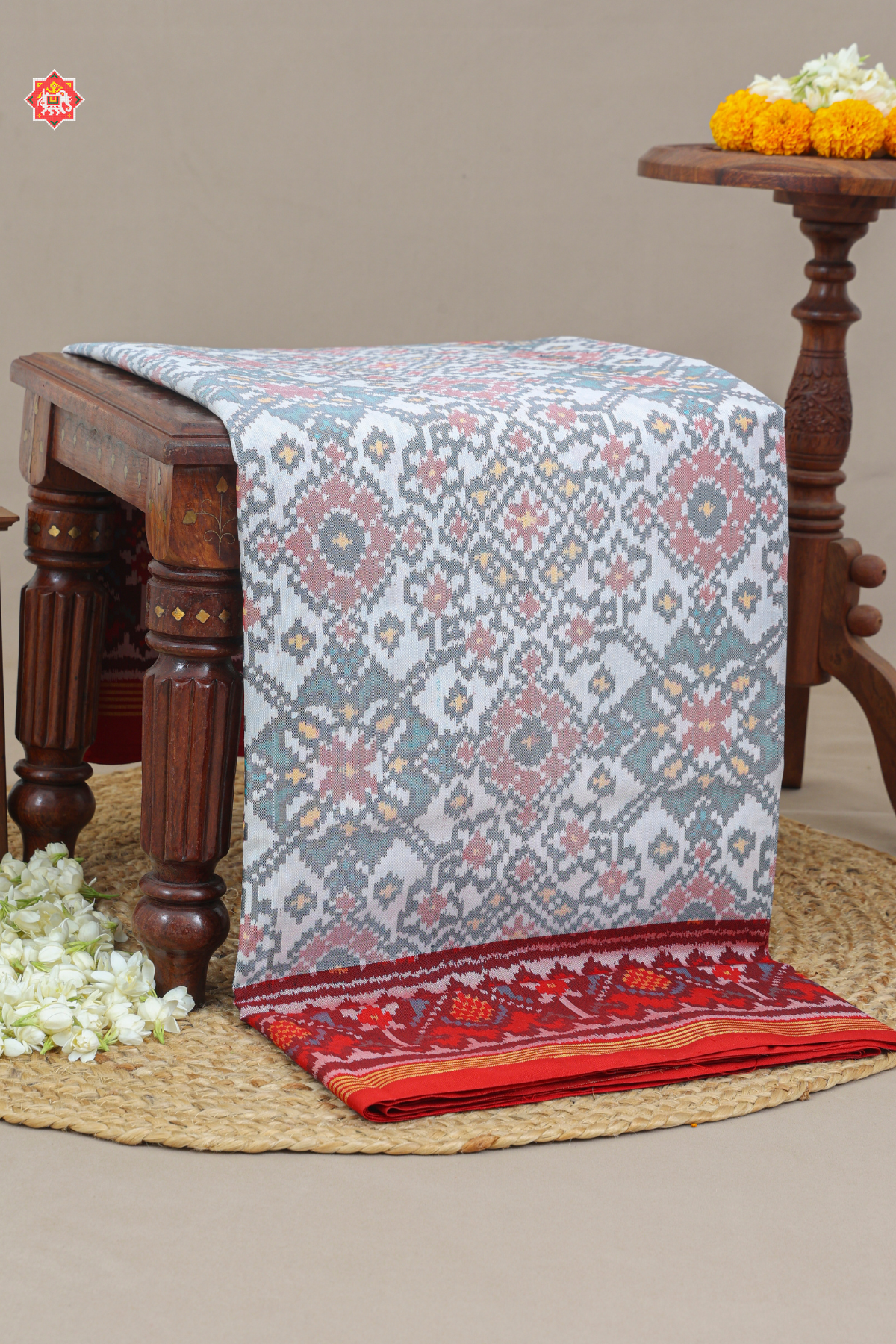 Traditional navratn design with minakari work pallu border contras semi double ikat patola saree