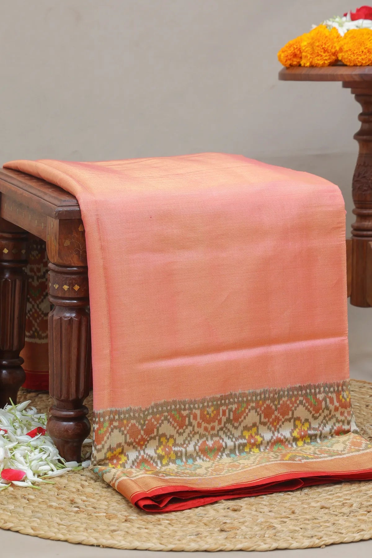 Plain pink with off white navratna manek chowk border tissue patola saree