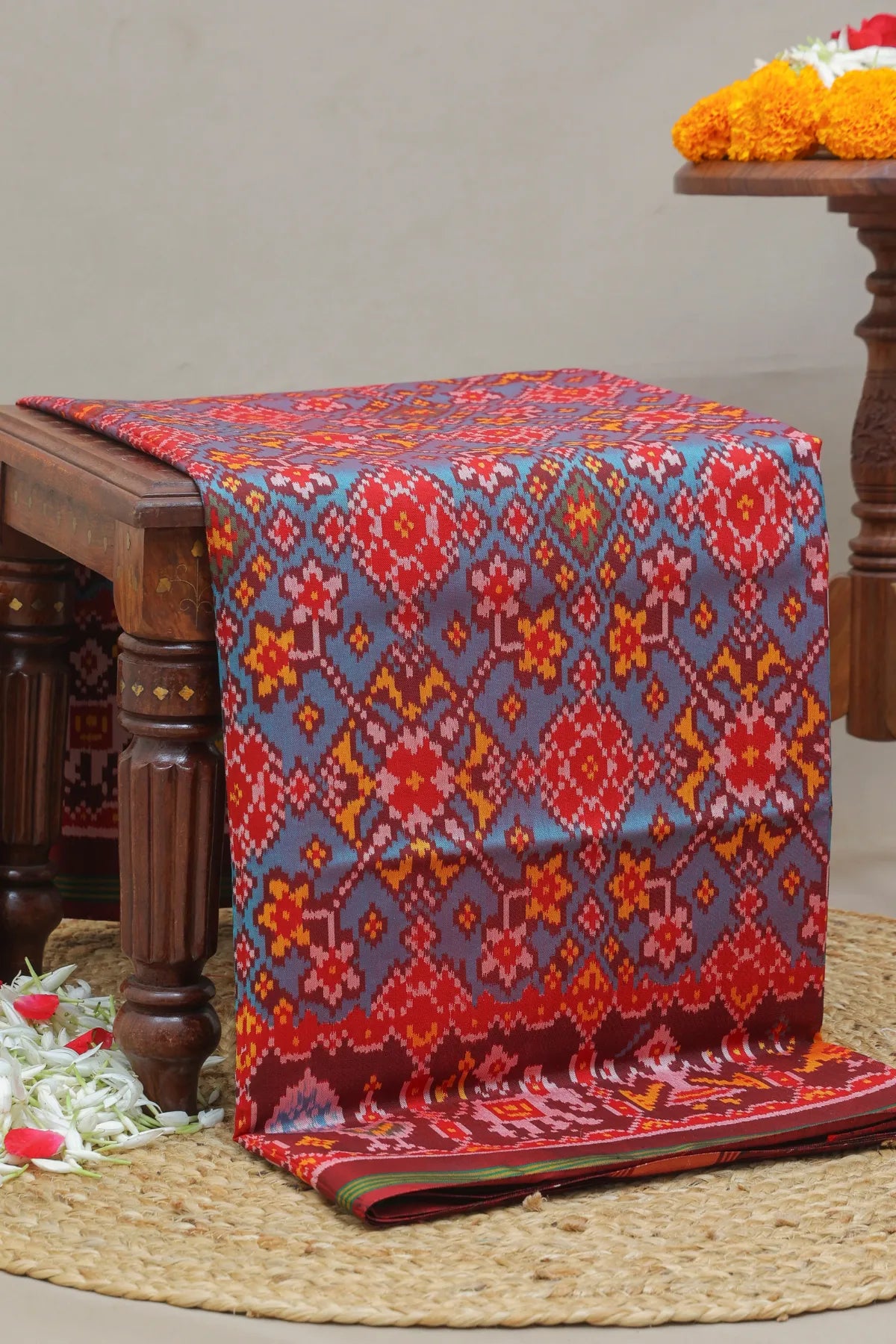 Traditional navratna design with pallu border motif design  semi double ikat patola saree