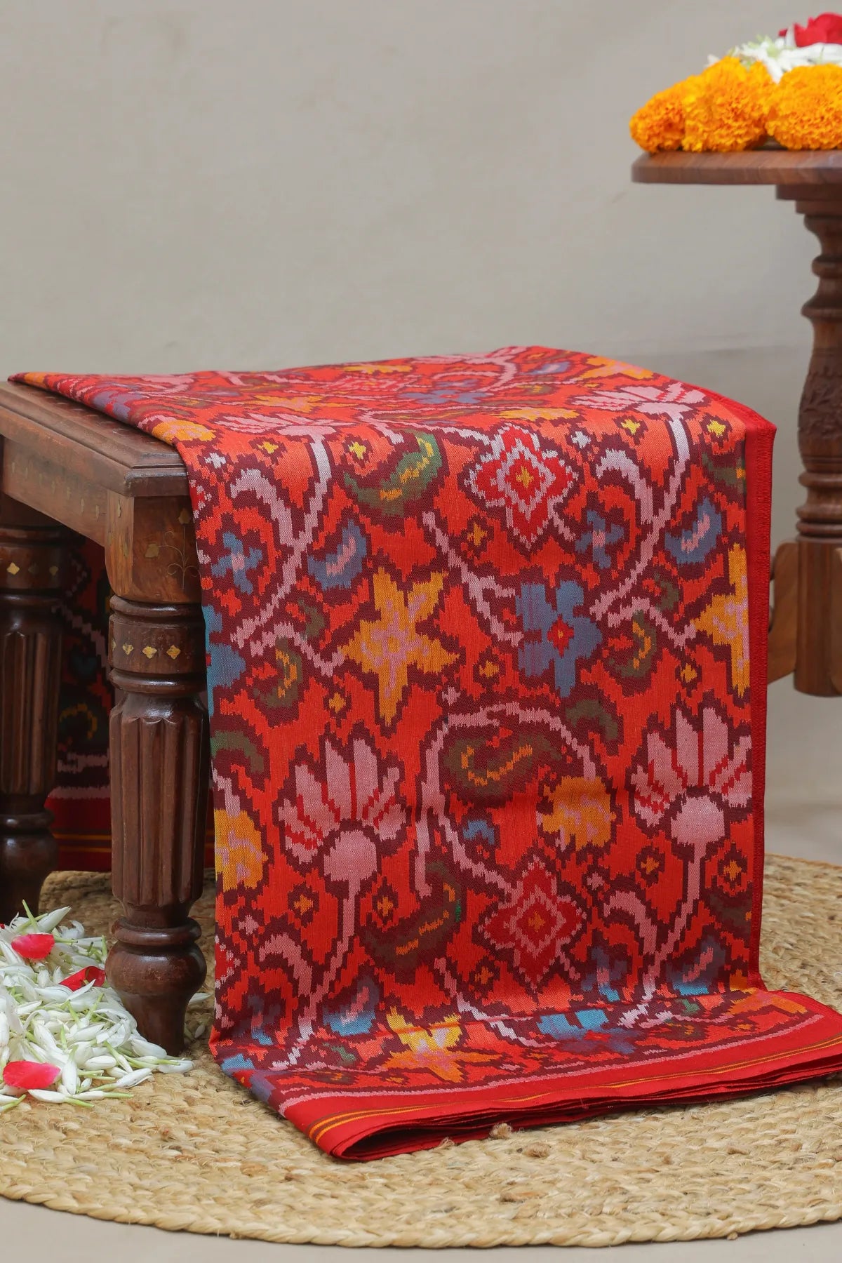 Masterpiece rangoli design with lines border traditional pallu design semi double ikat patola saree