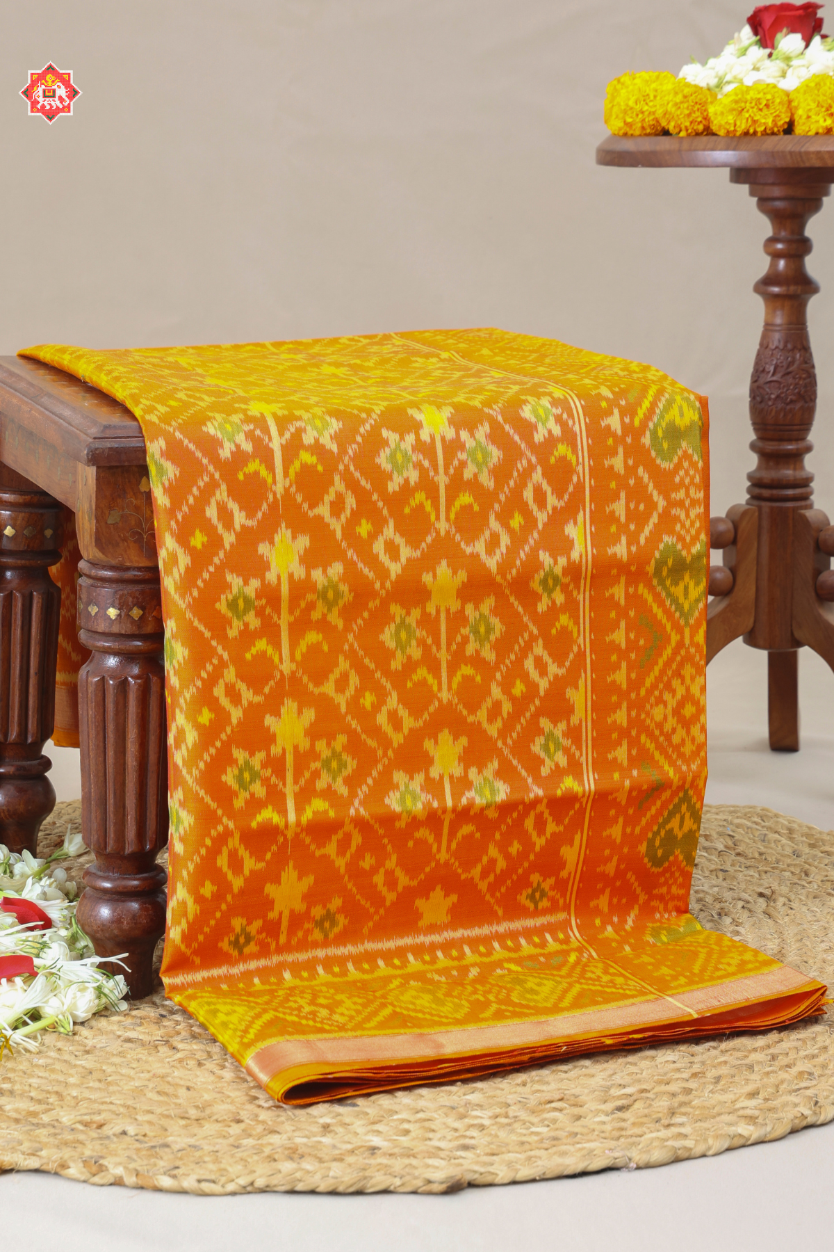 Traditional flowers design small tissue border single ikat patola saree