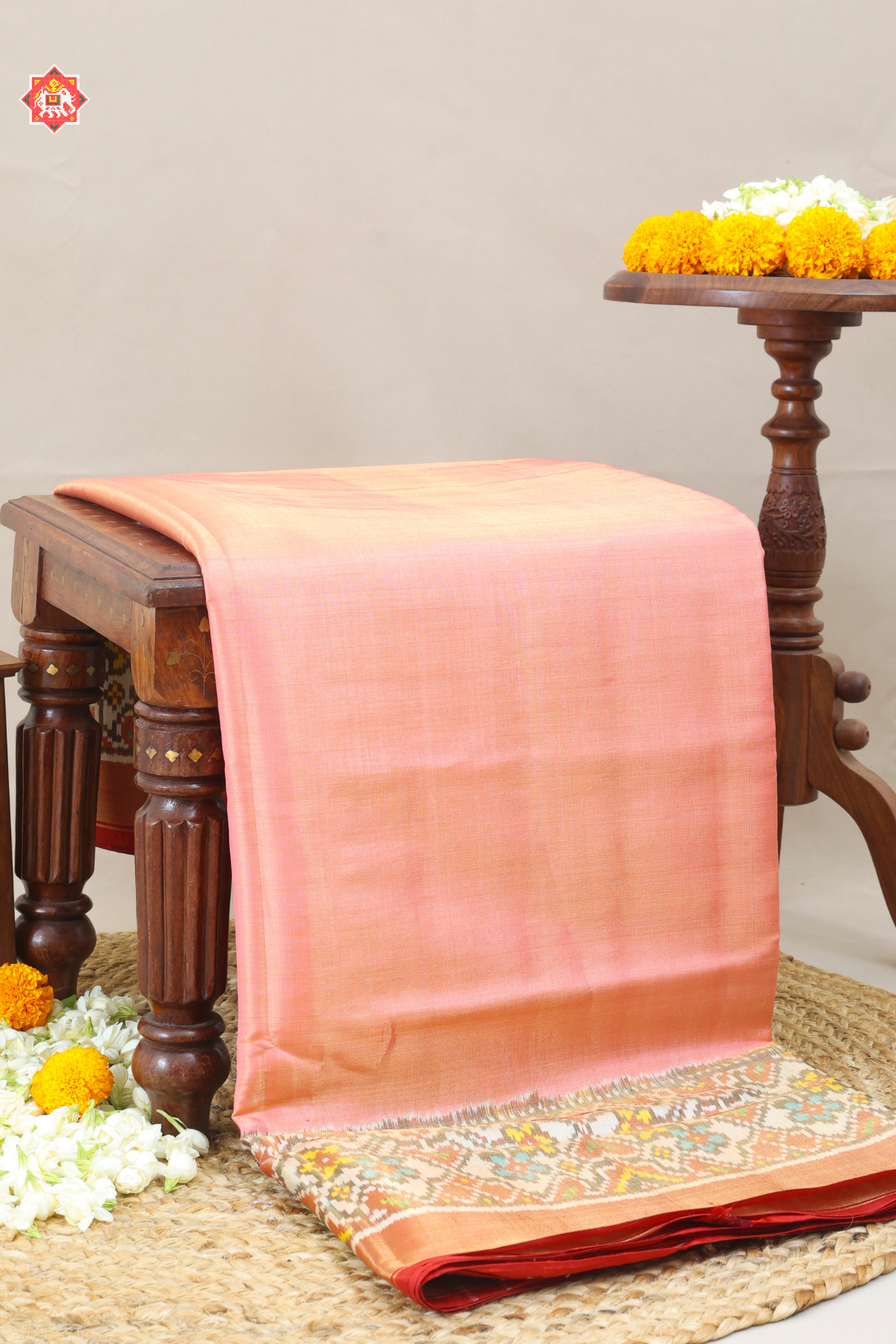 Plain pink with off white navratna manek chowk border tissue patola saree
