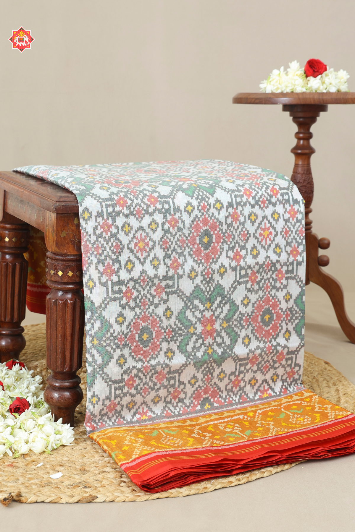 Traditional navratna design with minakari work tissue border single ikat patola