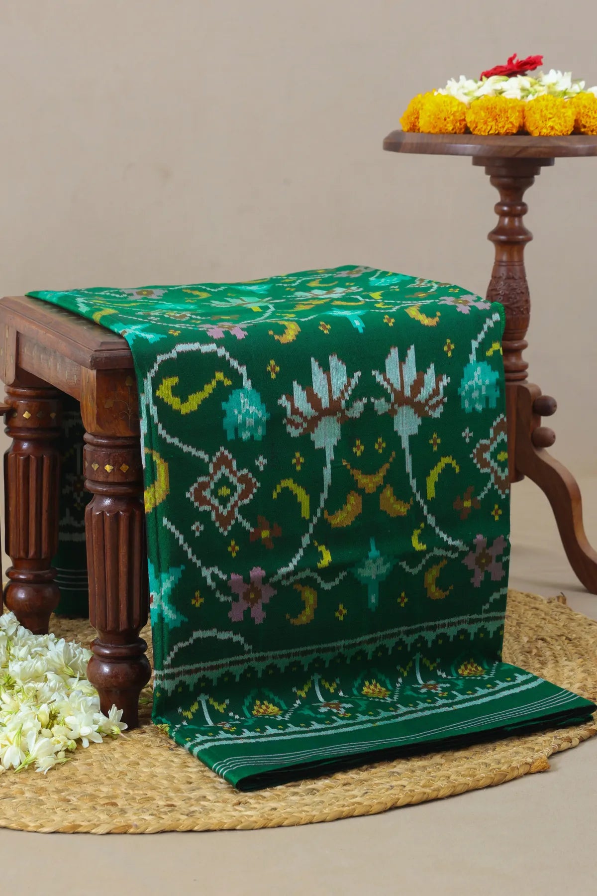 Rangoli design with pallu border traditional semi double ikat patola saree