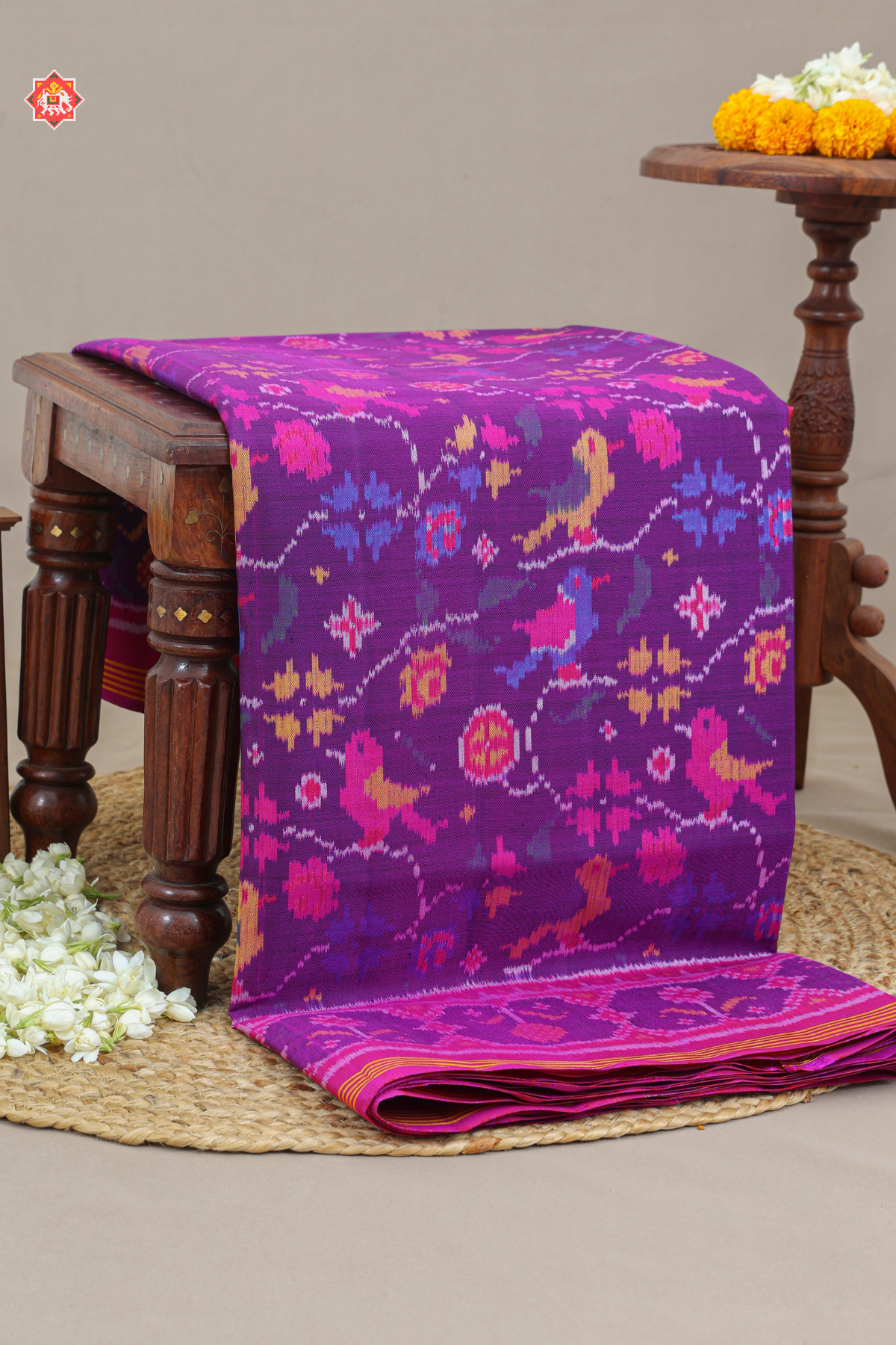 Vell design with motif design ghughroo border semi double ikat patola saree
