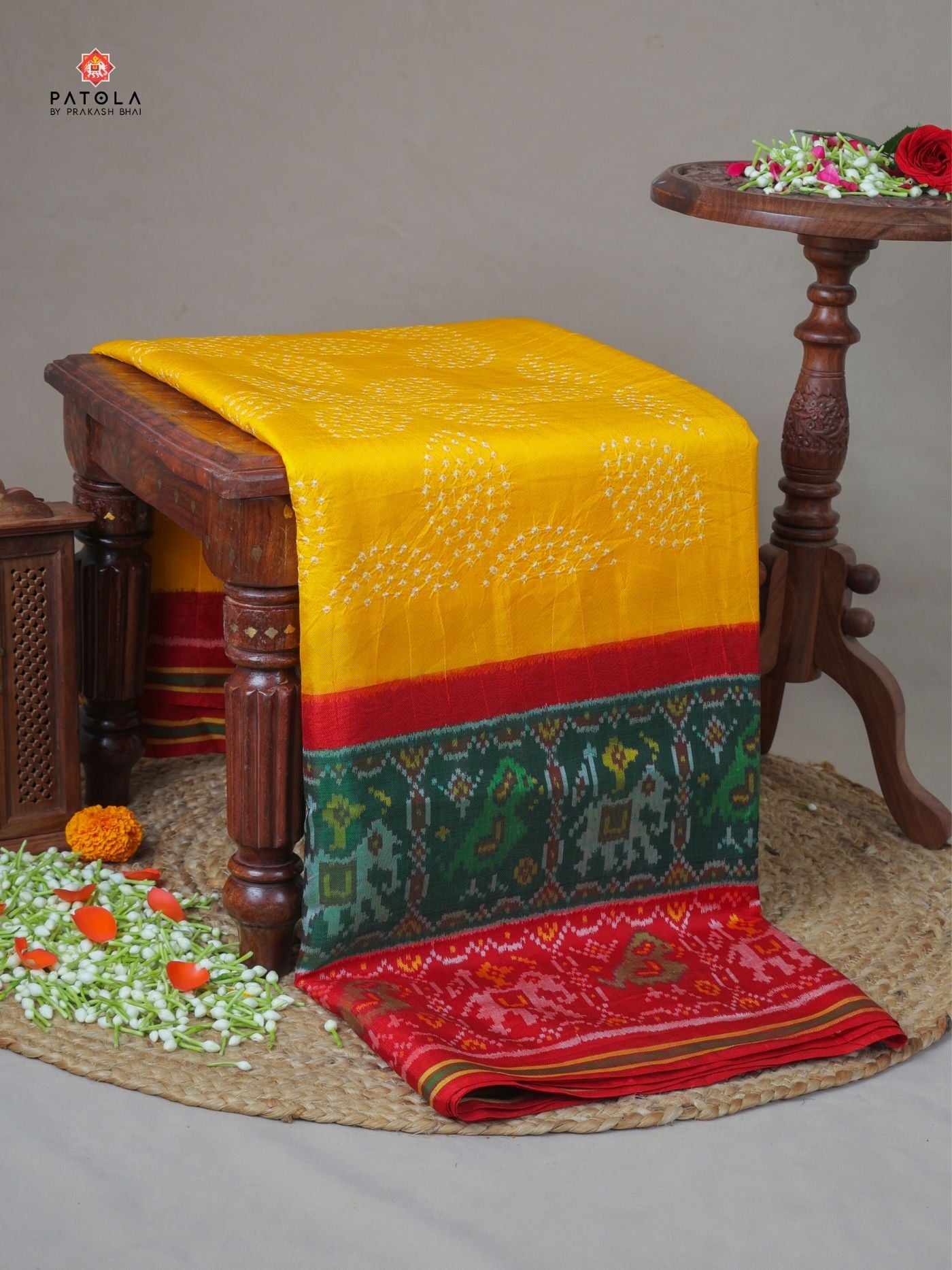 Two colors border with small bandhej patola saree Blouse design