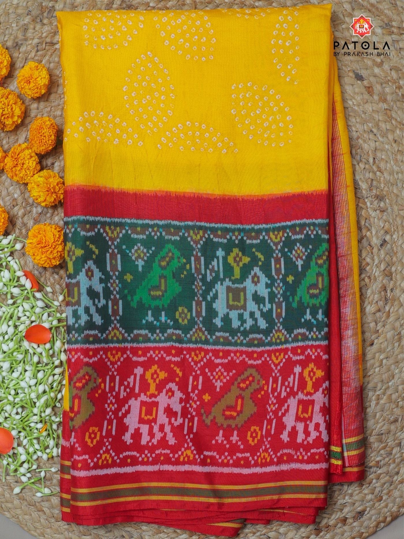 Two colors border with small bandhej patola saree Blouse design