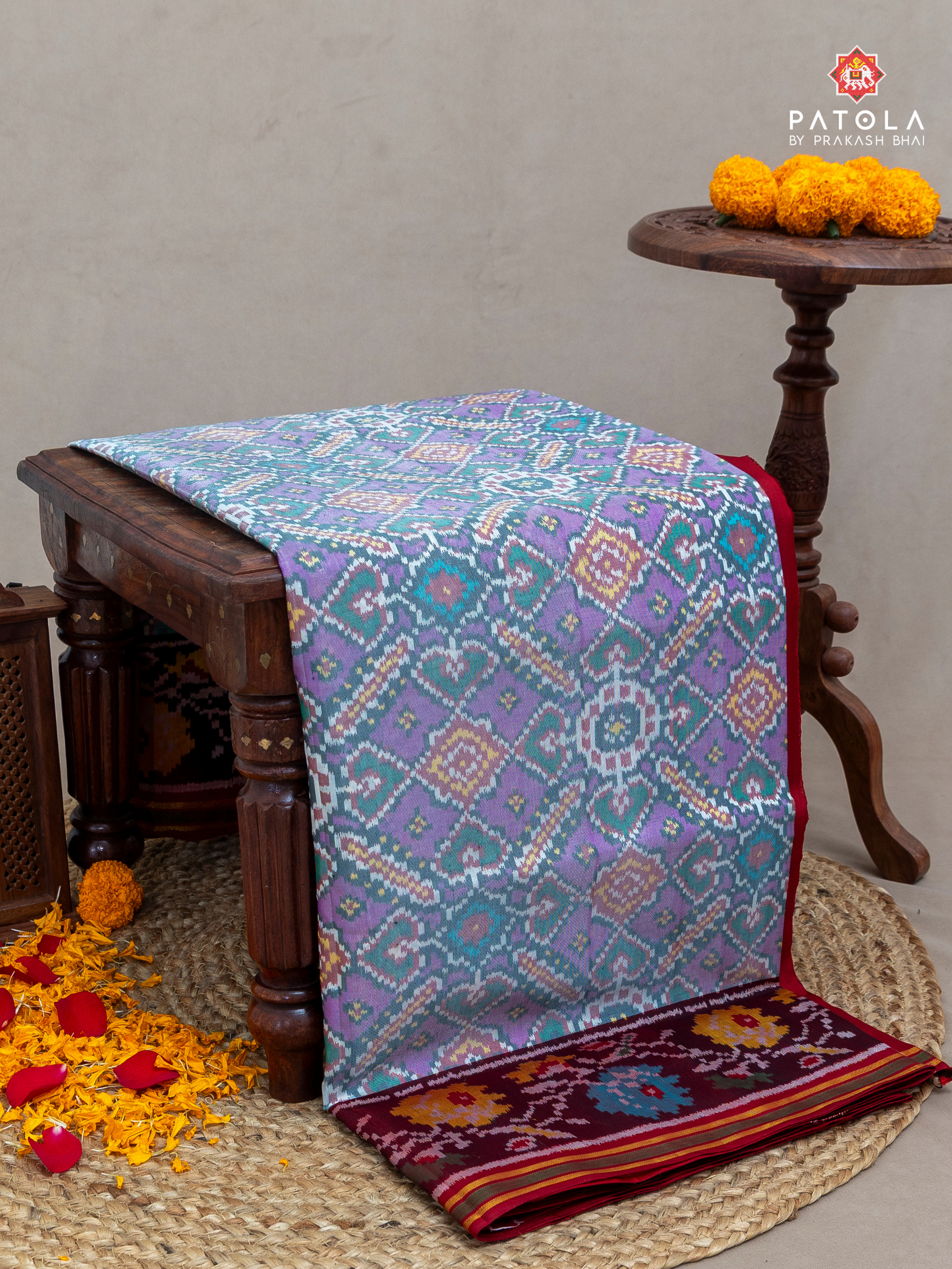 Manek chowk with panchanda mix design flowers border semi double ikat patola saree