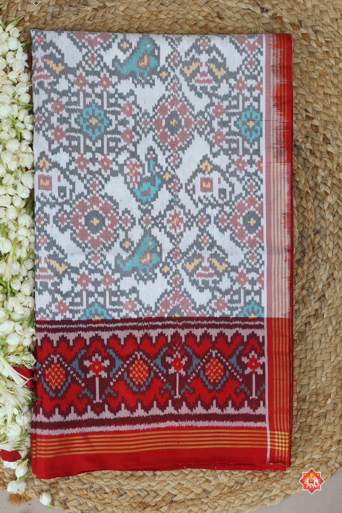 Traditional navratn design with small motif design semi double ikat patola saree