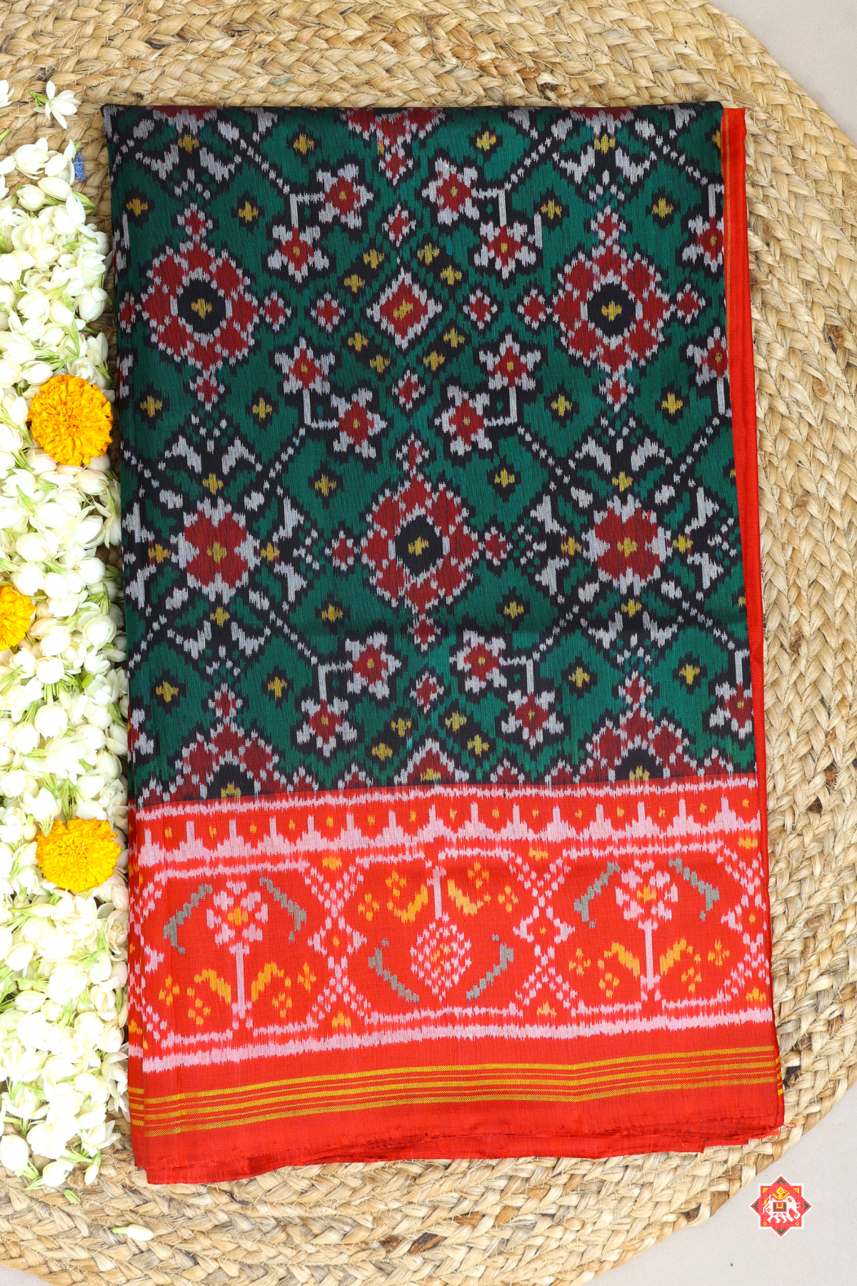 Traditional navratn design with minakari work pallu border contras semi double ikat patola saree
