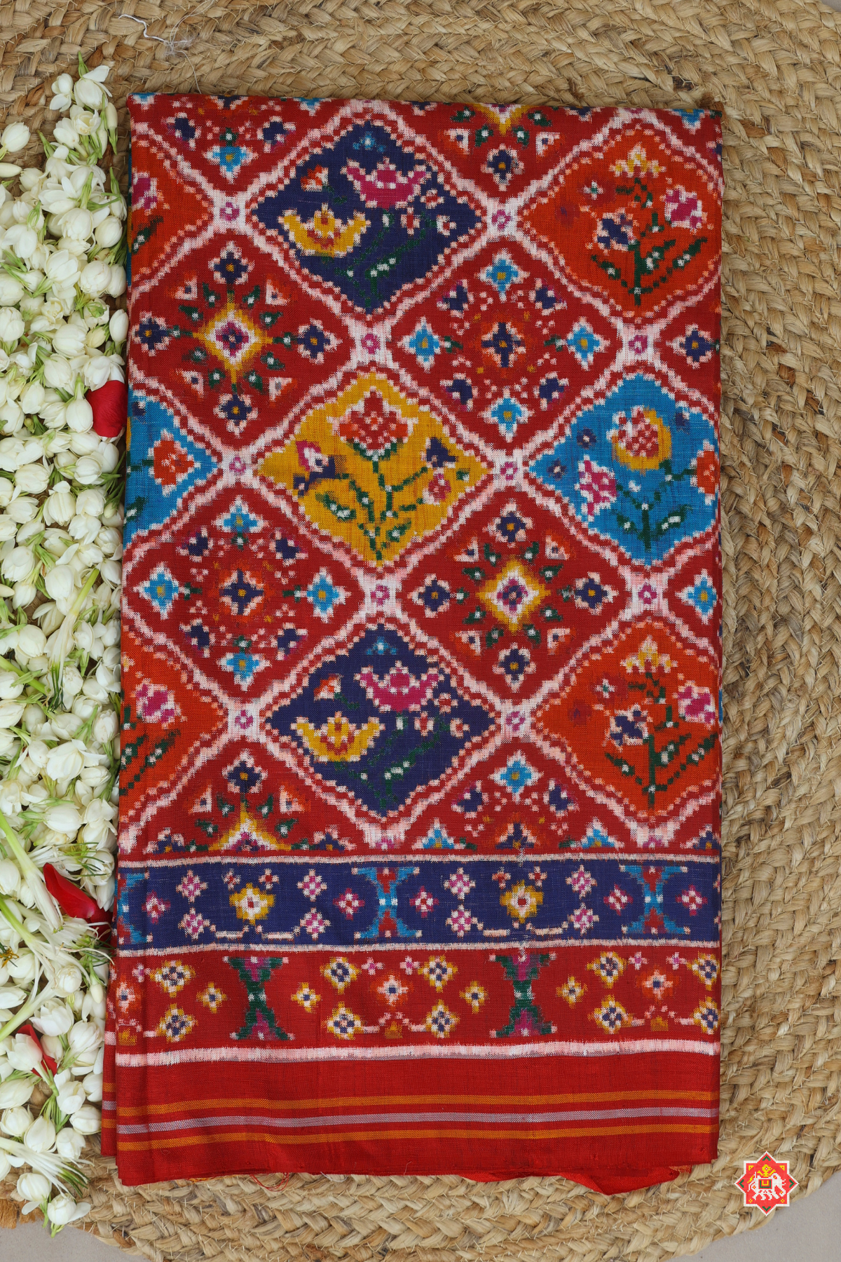 "Patan patola the pardah motif (curtain design) with its array of regal animal and  stylized floral figures,captures in a traditional geometric field."