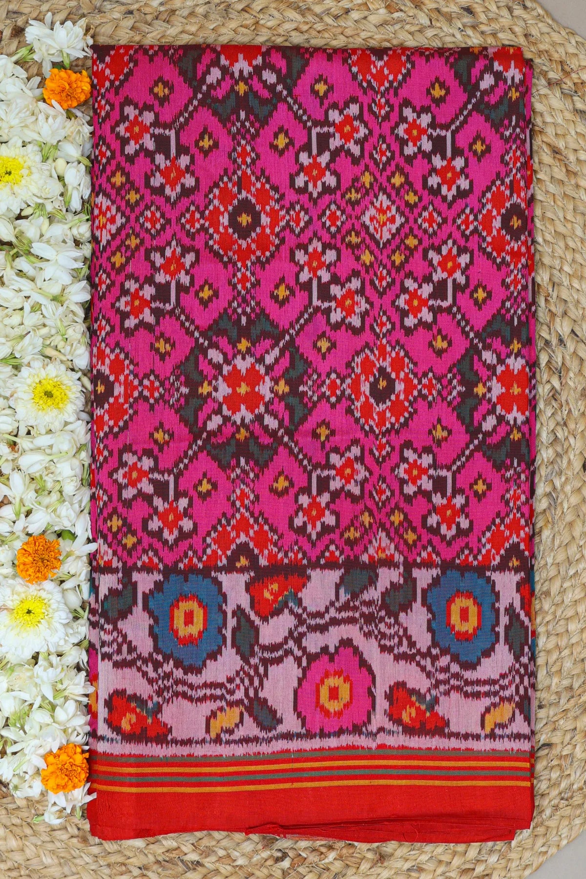 Navratna design with flowers border semi double ikat patola saree
