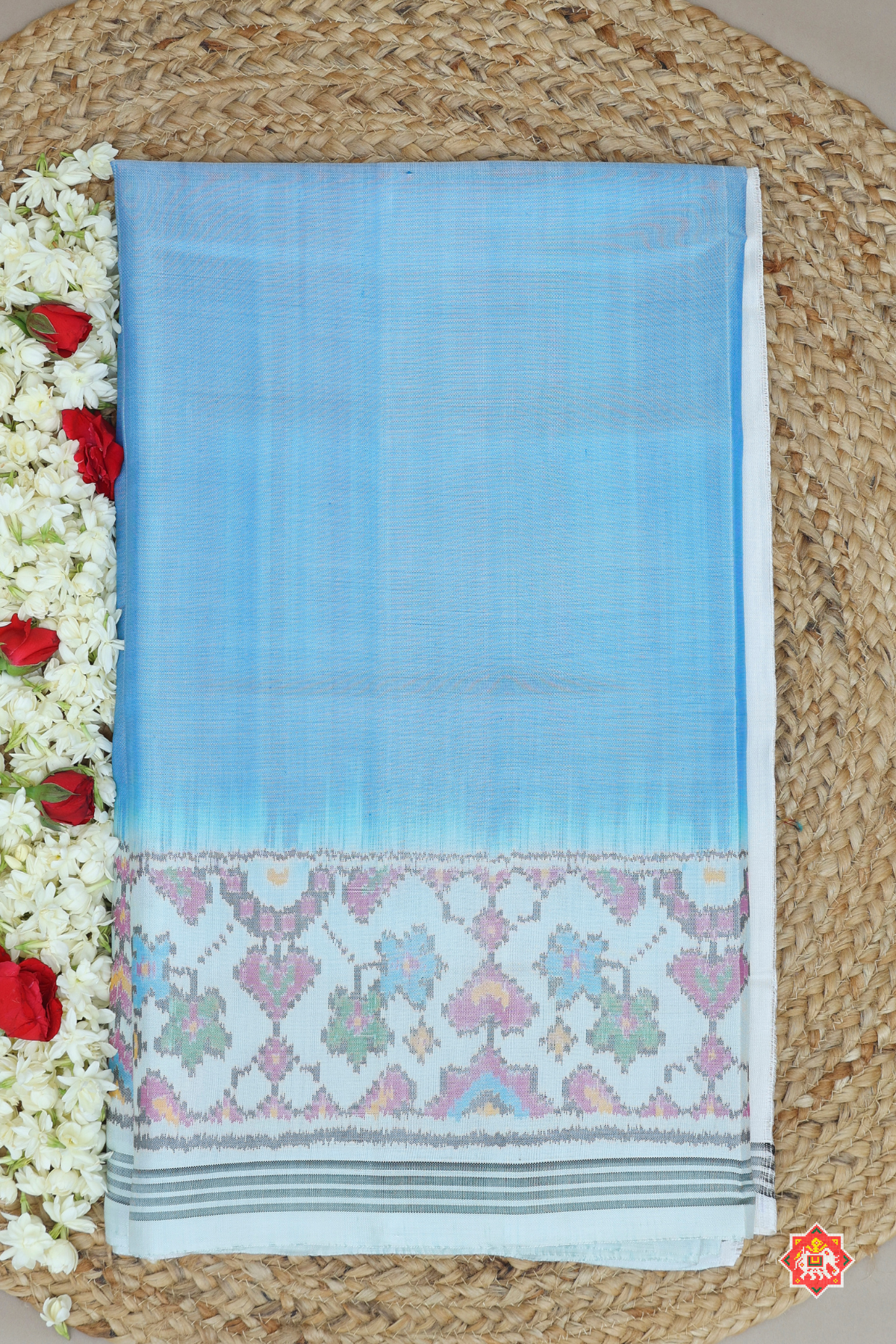 Plain sky with off-white navratna manek chowk border & blouse patola design semi double ikat patola saree