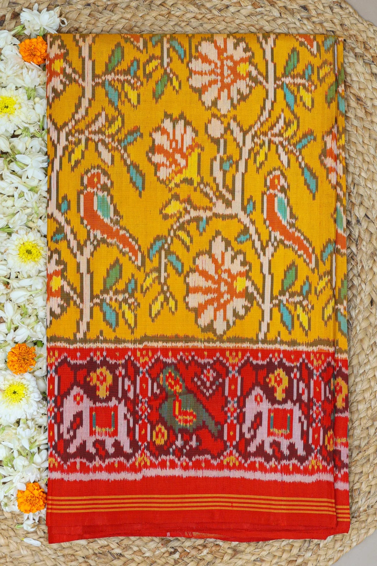 Fancy flower design with motifs design pallu border traditional design semi double ikat patola saree