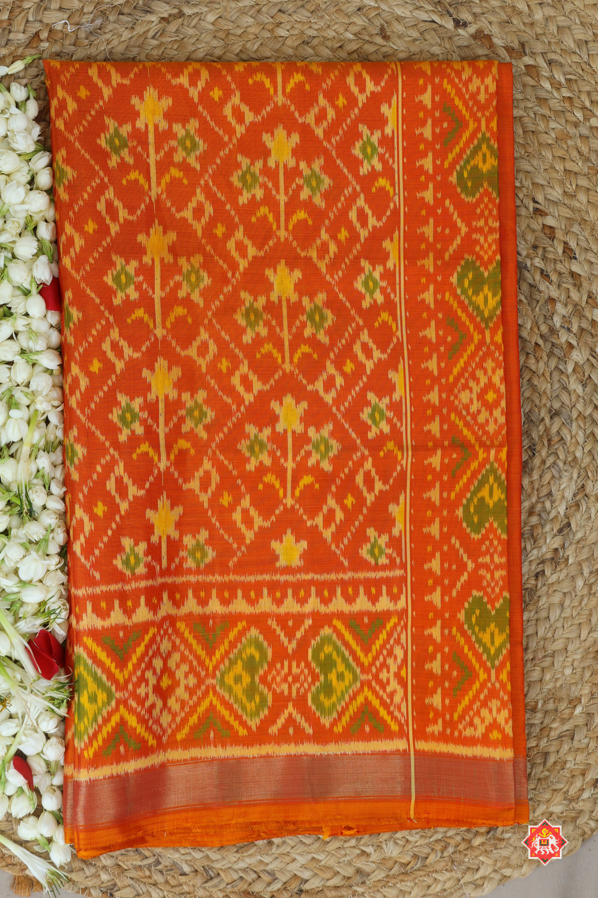 Traditional flowers design small tissue border single ikat patola saree