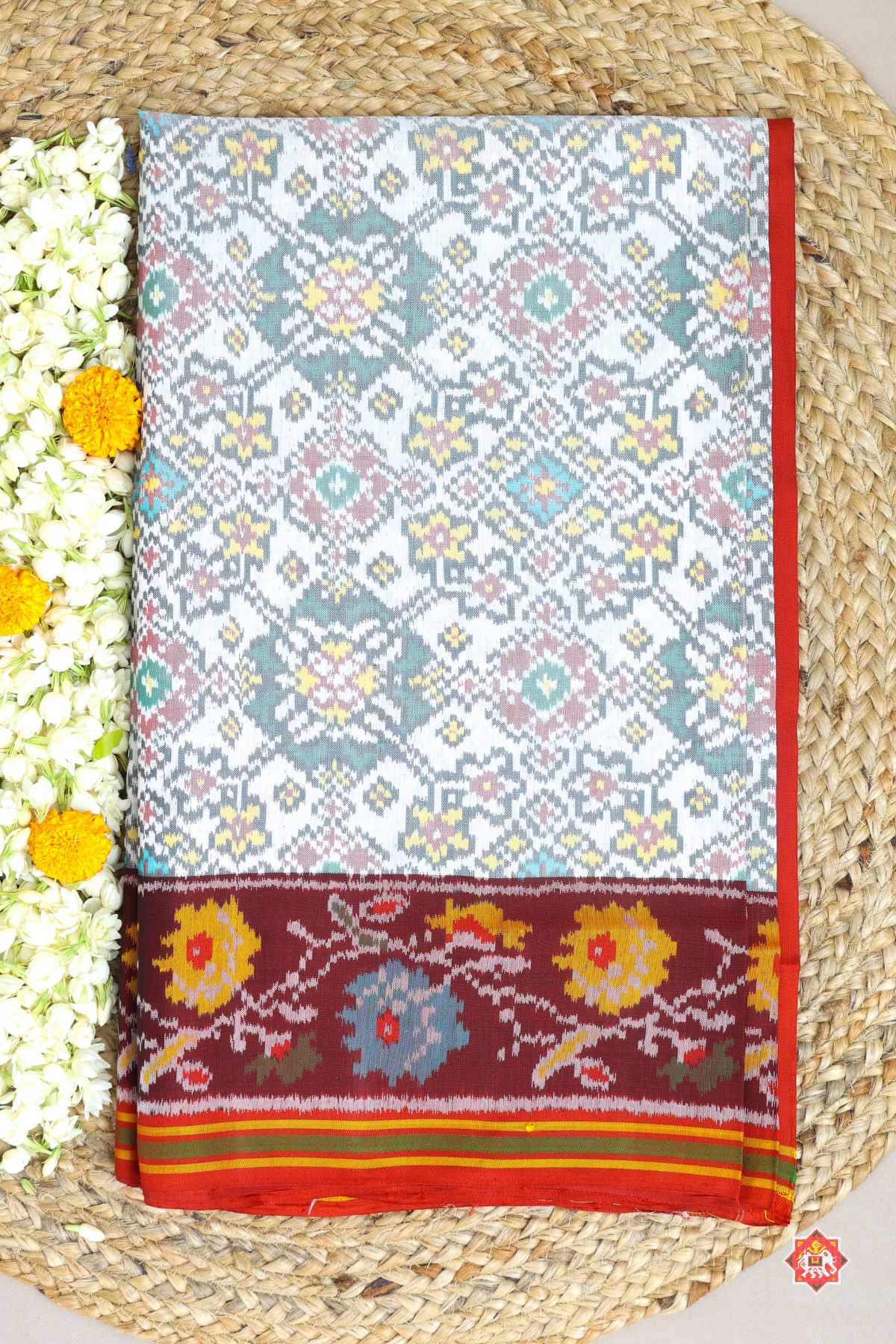 Traditional navrat design minakari work with flower border design semi double ikat patola saree